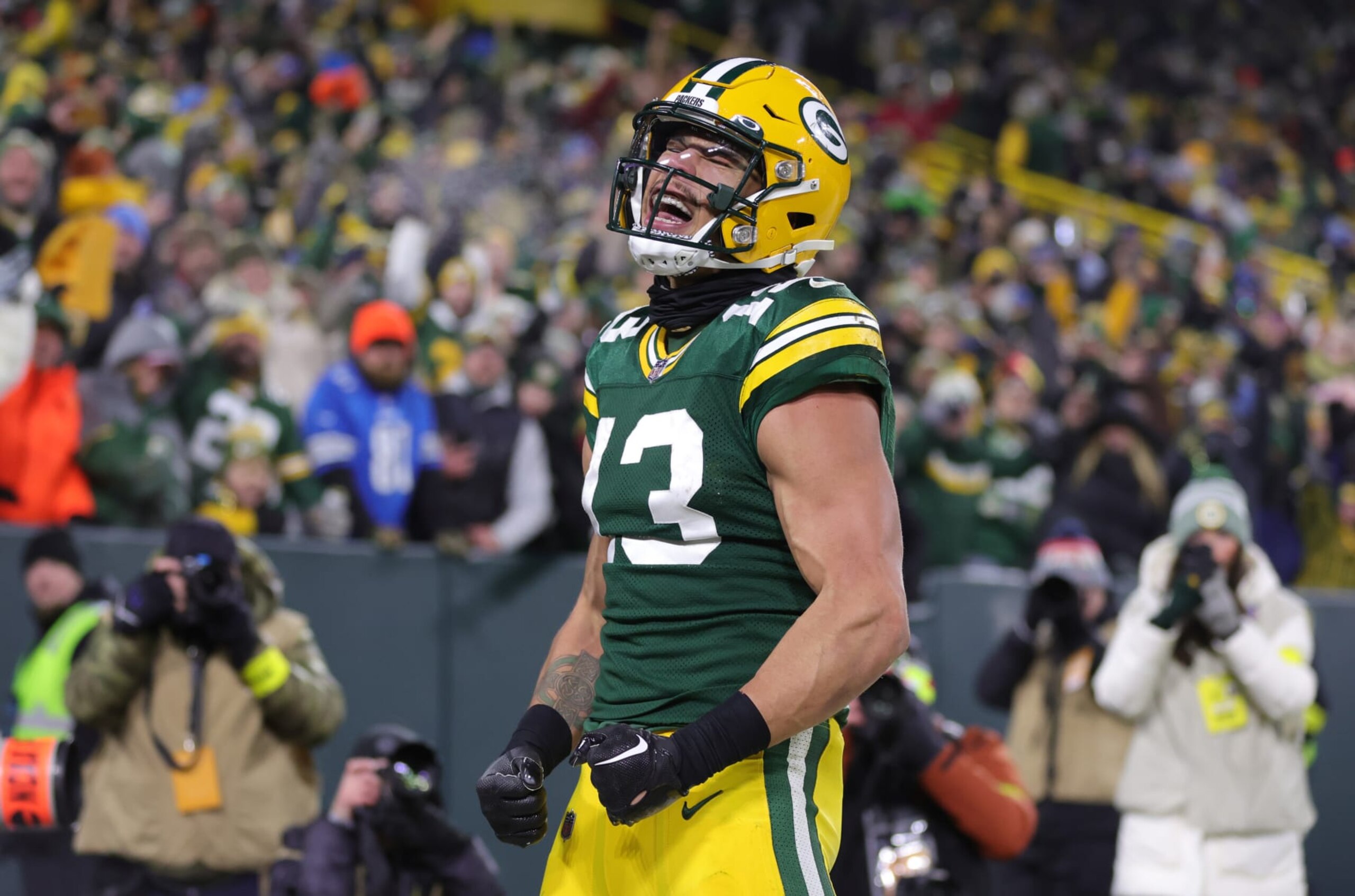 GREEN BAY, WISCONSIN - JANUARY 08: Allen Lazard #13 of the Green Bay Packers celebrates after catching a touchdown pass during the third quarter against the Detroit Lions at Lambeau Field on January 08, 2023 in Green Bay, Wisconsin. (Photo by Stacy Revere/Getty Images)