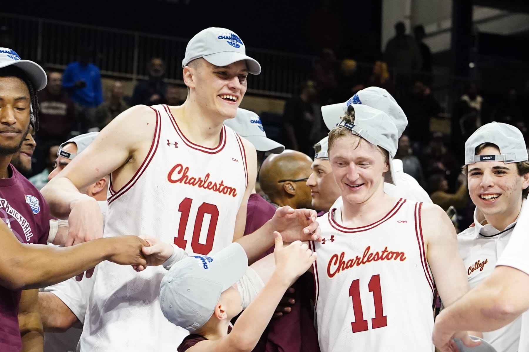 WASHINGTON, DC - MARCH 07: Charleston Cougars Forward Ante Brzovic (10) and Charleston Cougars Guard Ryan Larson (11) celebrate the victory after the College Basketball CAA Conference Tournament Championship Game between the UNC Wilmington Seahawks and the Charleston Cougars on March 7, 2023, at the Entertainment & Sports Arena in Washington DC. (Photo by Gregory Fisher/Icon Sportswire via Getty Images)