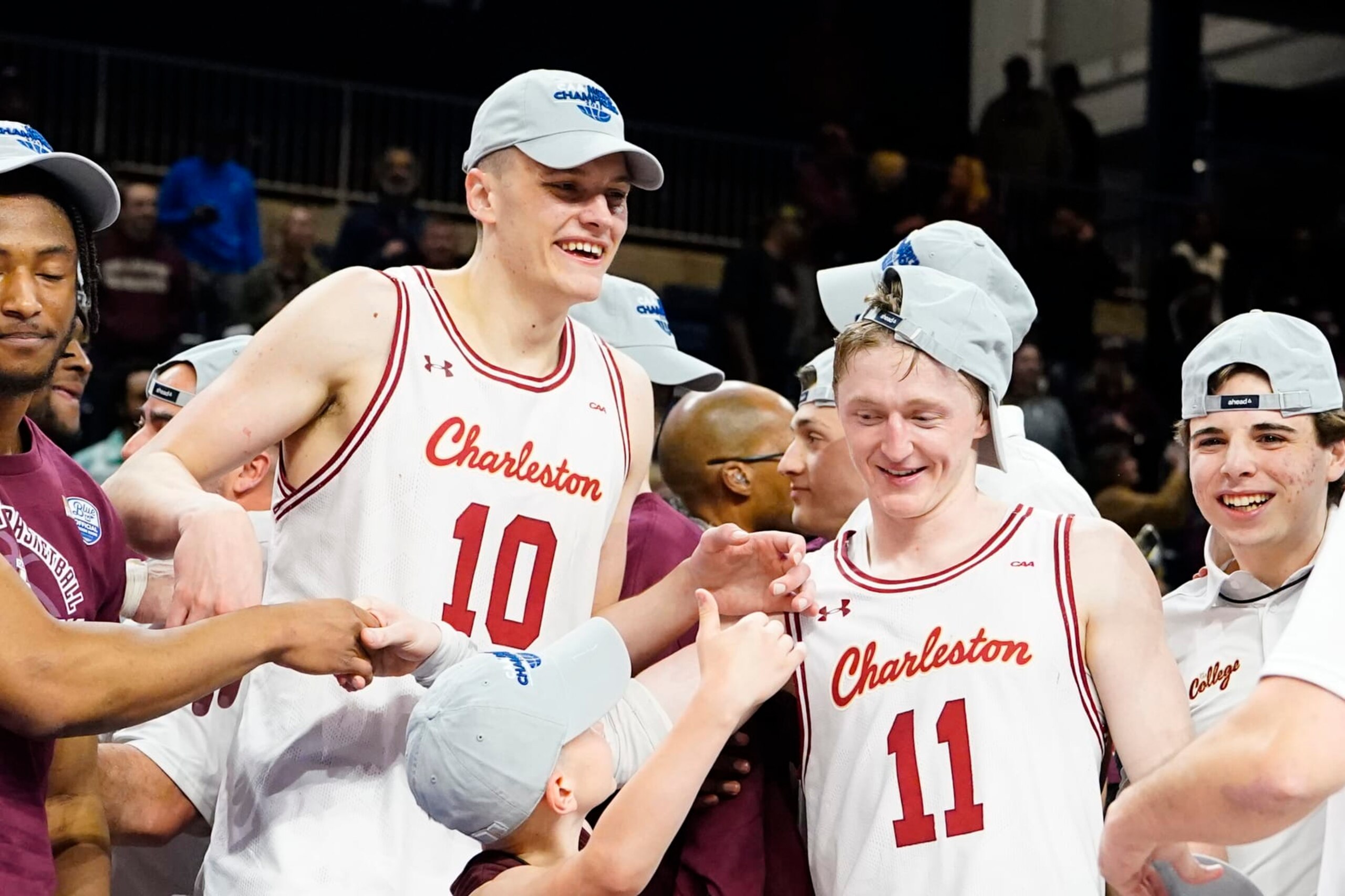 WASHINGTON, DC - MARCH 07: Charleston Cougars Forward Ante Brzovic (10) and Charleston Cougars Guard Ryan Larson (11) celebrate the victory after the College Basketball CAA Conference Tournament Championship Game between the UNC Wilmington Seahawks and the Charleston Cougars on March 7, 2023, at the Entertainment & Sports Arena in Washington DC. (Photo by Gregory Fisher/Icon Sportswire via Getty Images)
