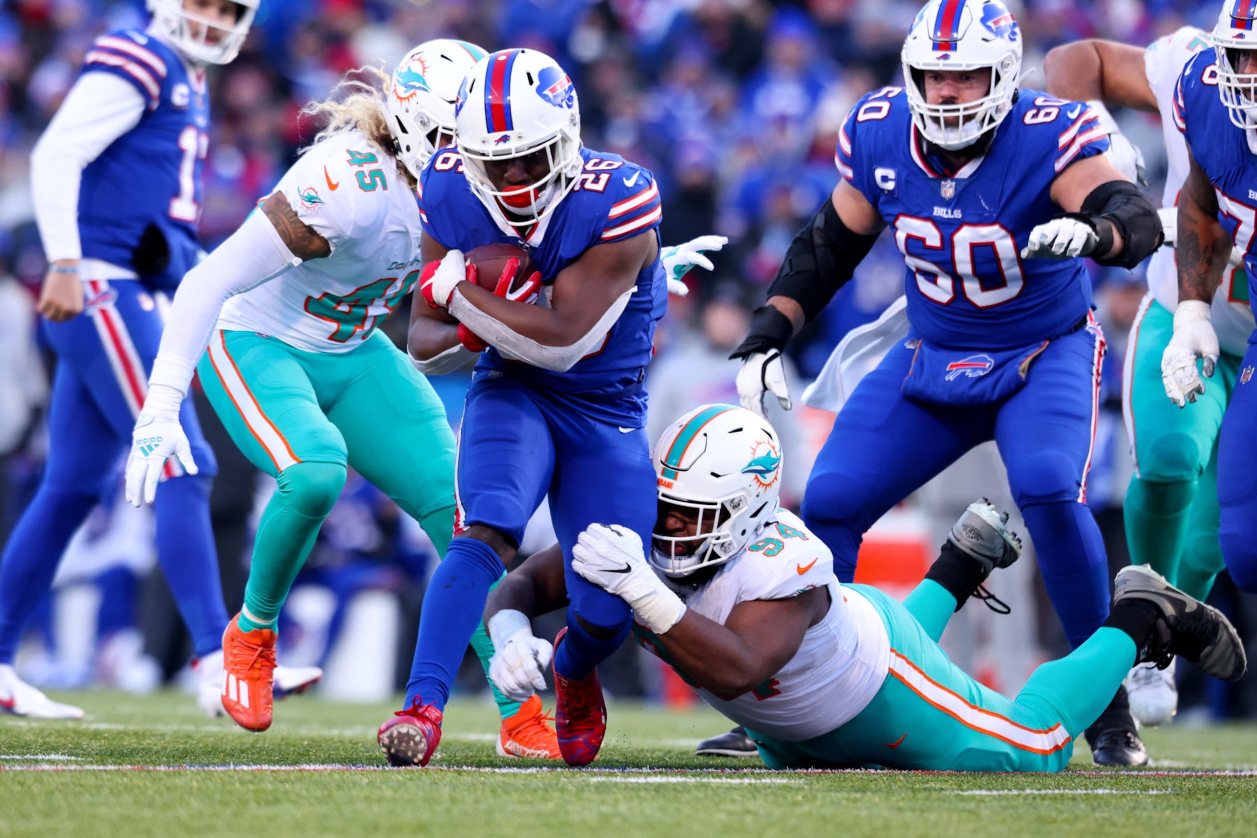 ORCHARD PARK, NEW YORK - JANUARY 15: Devin Singletary #26 of the Buffalo Bills carries the ball against the Miami Dolphins during the second half of the game in the AFC Wild Card playoff game at Highmark Stadium on January 15, 2023 in Orchard Park, New York. (Photo by Bryan M. Bennett/Getty Images)