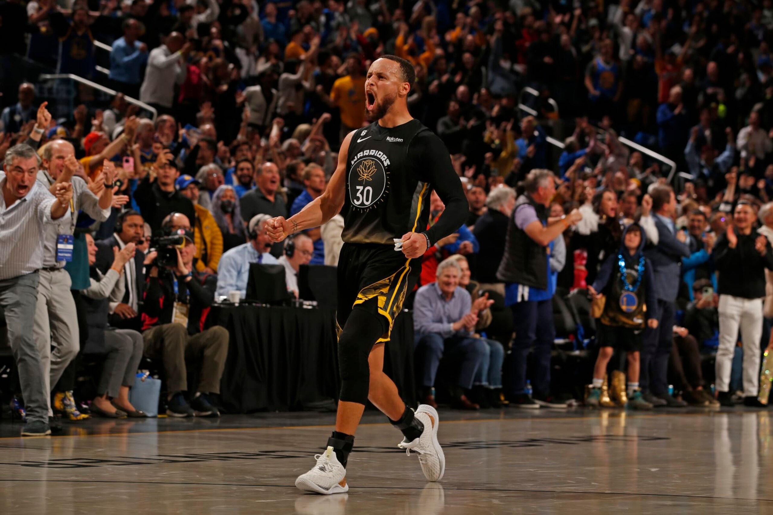 SAN FRANCISCO, CA - MARCH 11: Stephen Curry #30 of the Golden State Warriors celebrates the game-tying shot against the Milwaukee Bucks on March 11, 2023 at Chase Center in San Francisco, California. NOTE TO USER: User expressly acknowledges and agrees that, by downloading and or using this photograph, user is consenting to the terms and conditions of Getty Images License Agreement. Mandatory Copyright Notice: Copyright 2023 NBAE (Photo by Jed Jacobsohn/NBAE via Getty Images)
