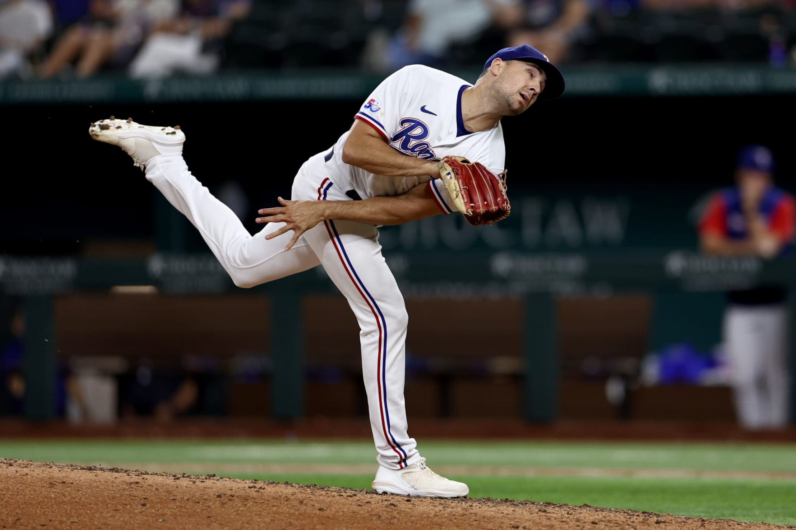 ARLINGTON, TEXAS - SEPTEMBER 13: Brock Burke #46 of the Texas Rangers pitches against the Oakland Athletics in the top of the eighth inning at Globe Life Field on September 13, 2022 in Arlington, Texas. (Photo by Tom Pennington/Getty Images)
