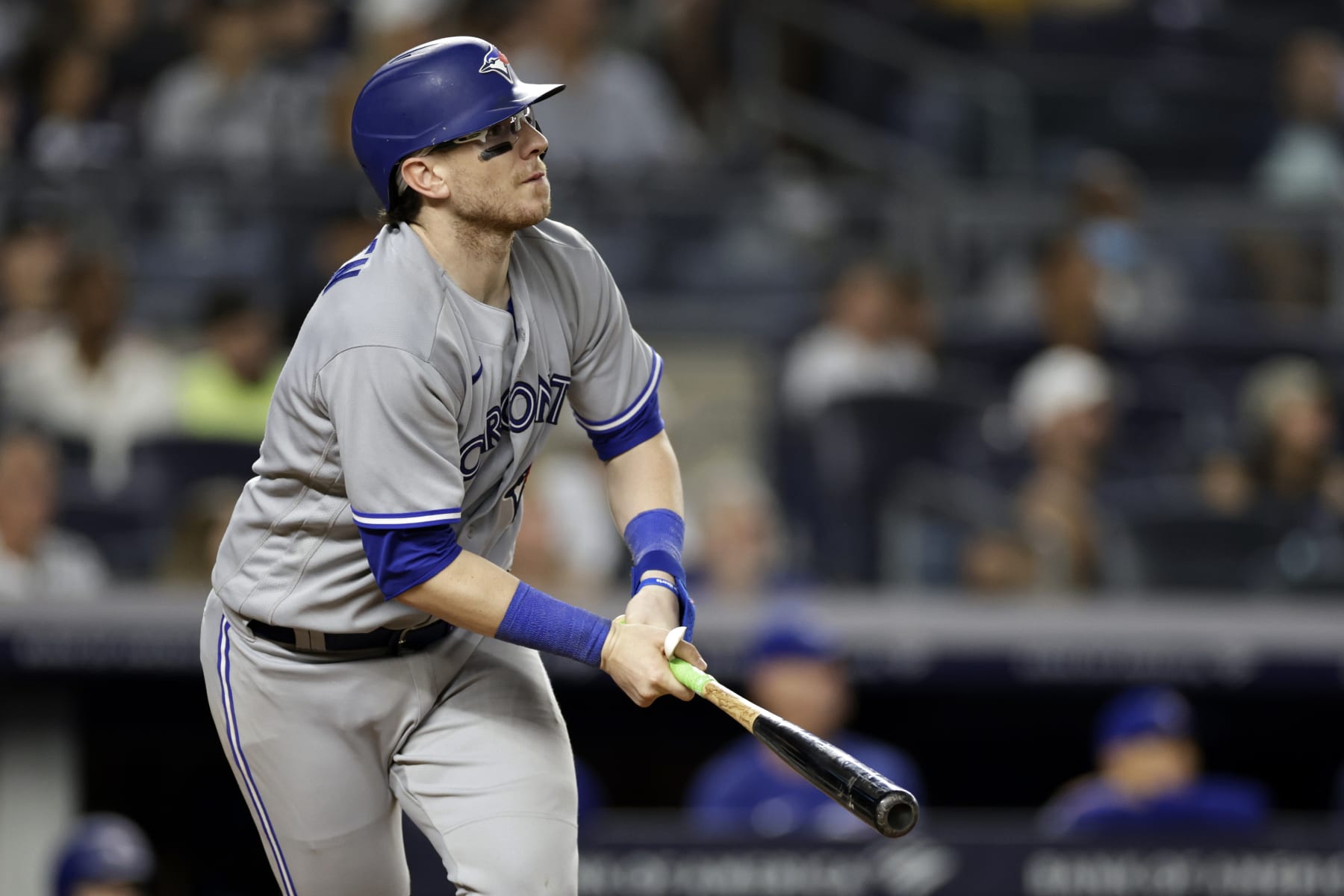 Toronto Blue Jays' Danny Jansen (9) watches his sacrifice fly during the ninth inning of the team's baseball game against the New York Yankees on Friday, Aug. 19, 2022, in New York. The Blue Jays won 4-0. (AP Photo/Adam Hunger)