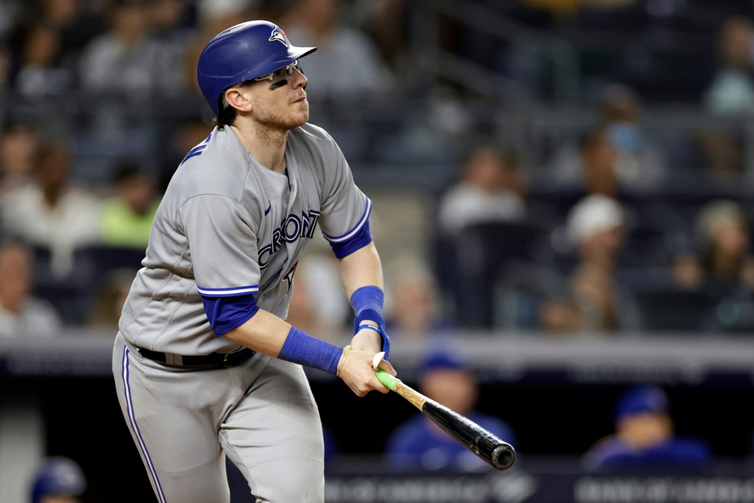Toronto Blue Jays' Danny Jansen (9) watches his sacrifice fly during the ninth inning of the team's baseball game against the New York Yankees on Friday, Aug. 19, 2022, in New York. The Blue Jays won 4-0. (AP Photo/Adam Hunger)