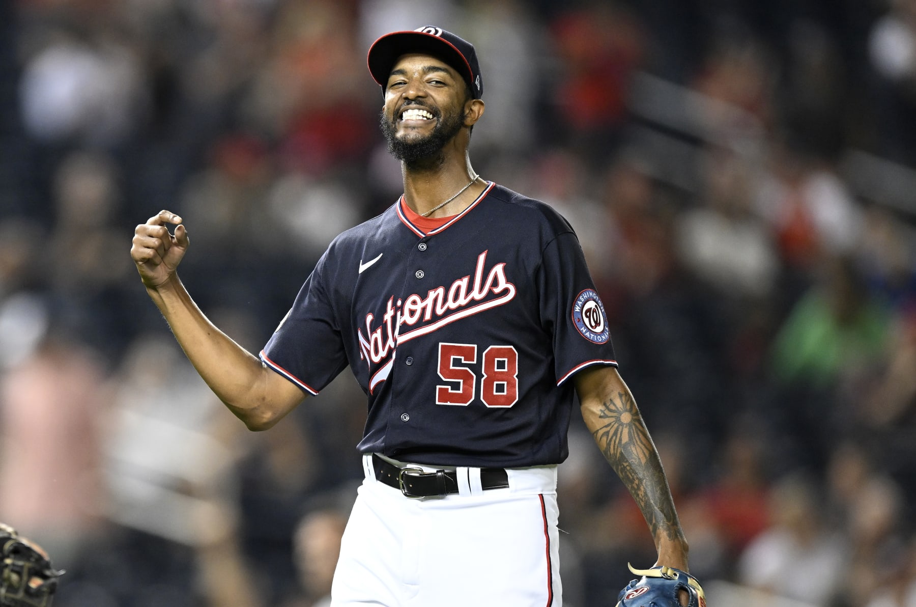 WASHINGTON, DC - SEPTEMBER 16: Carl Edwards Jr. #58 of the Washington Nationals celebrates during the game against the Miami Marlins at Nationals Park on September 16, 2022 in Washington, DC. (Photo by G Fiume/Getty Images)