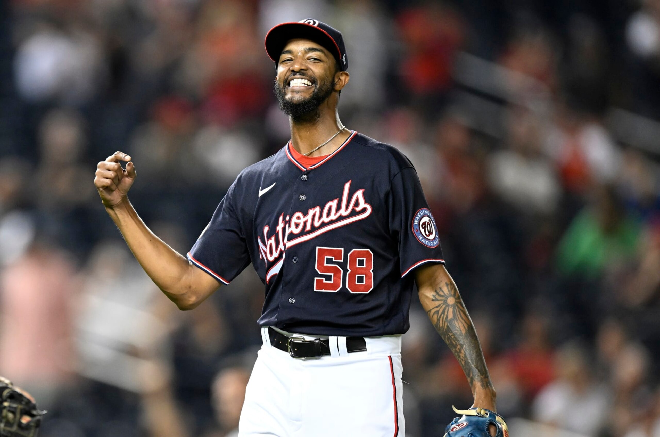 WASHINGTON, DC - SEPTEMBER 16: Carl Edwards Jr. #58 of the Washington Nationals celebrates during the game against the Miami Marlins at Nationals Park on September 16, 2022 in Washington, DC. (Photo by G Fiume/Getty Images)