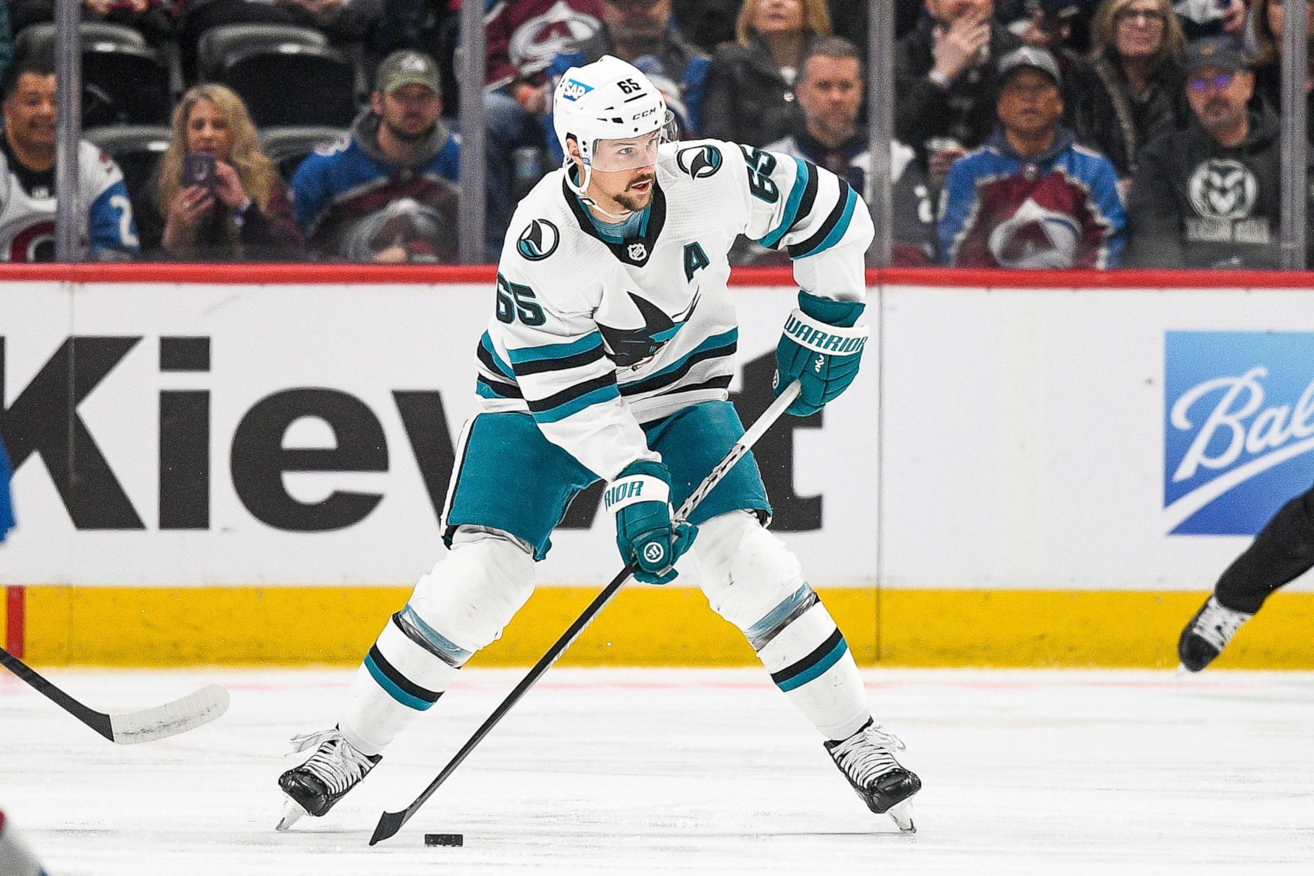 DENVER, COLORADO - MARCH 7:  Erik Karlsson #65 of the San Jose Sharks skates against the Colorado Avalanche in a game at Ball Arena on March 7, 2023 in Denver, Colorado. (Photo by Dustin Bradford/Getty Images)