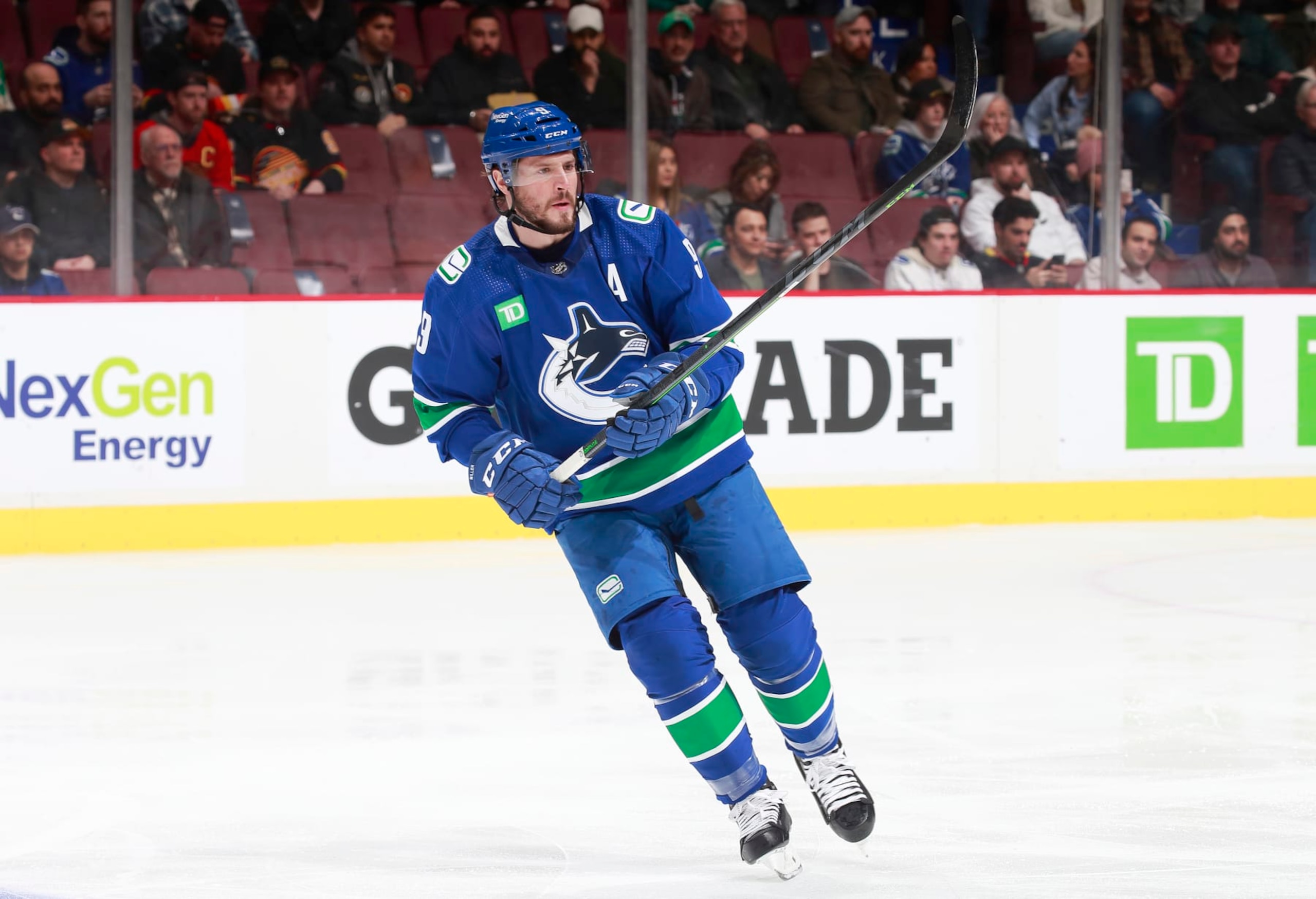 VANCOUVER, CANADA - MARCH 6:  J.T. Miller #9 of the Vancouver Canucks skates up the ice during the first period of their NHL game against the Nashville Predators at Rogers Arena March 6, 2023 in Vancouver, British Columbia, Canada.  (Photo by Jeff Vinnick/NHLI via Getty Images)