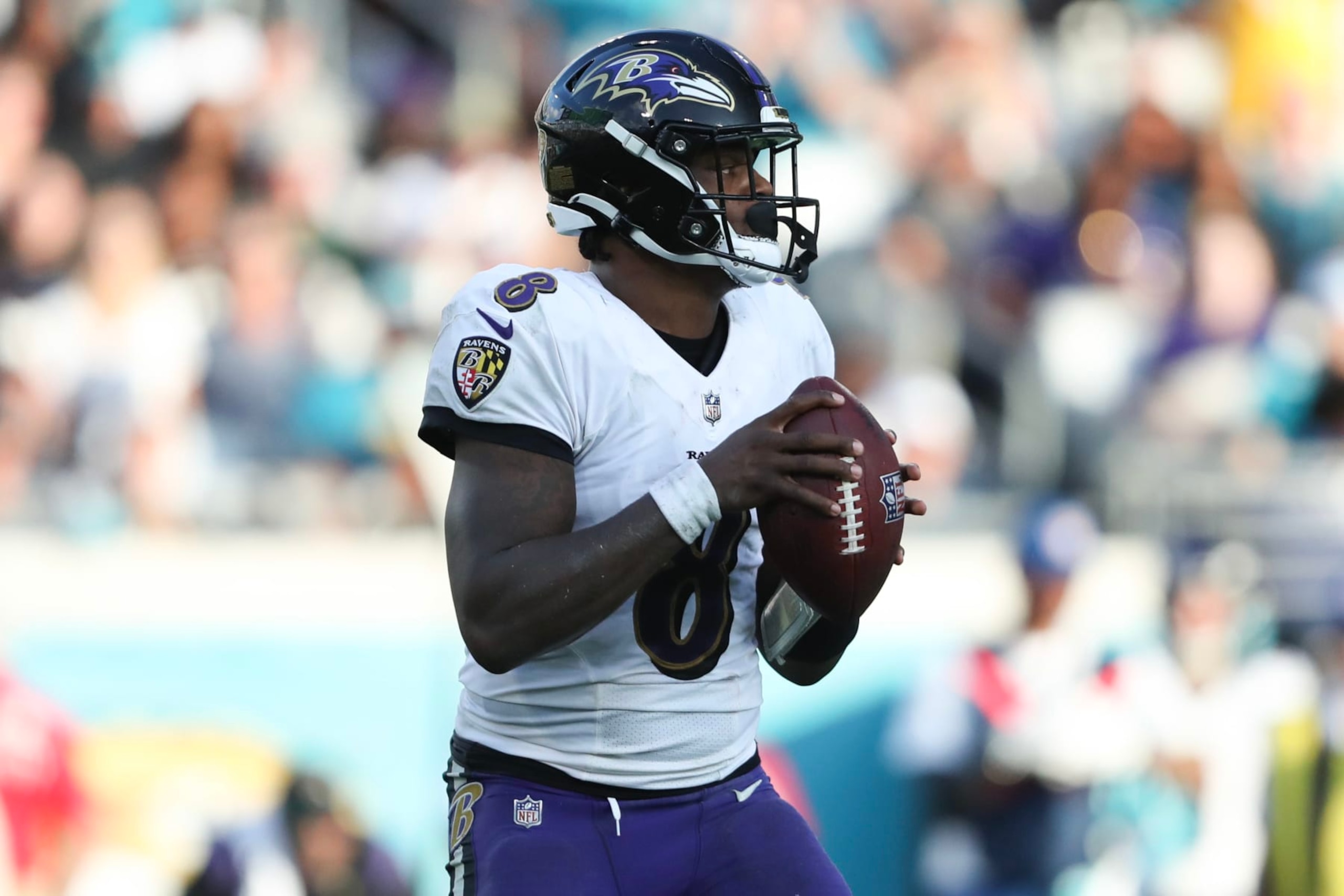 JACKSONVILLE, FLORIDA - NOVEMBER 27: Lamar Jackson #8 of the Baltimore Ravens drops back to pass during the second half against the Jacksonville Jaguars at TIAA Bank Field on November 27, 2022 in Jacksonville, Florida. (Photo by Courtney Culbreath/Getty Images)