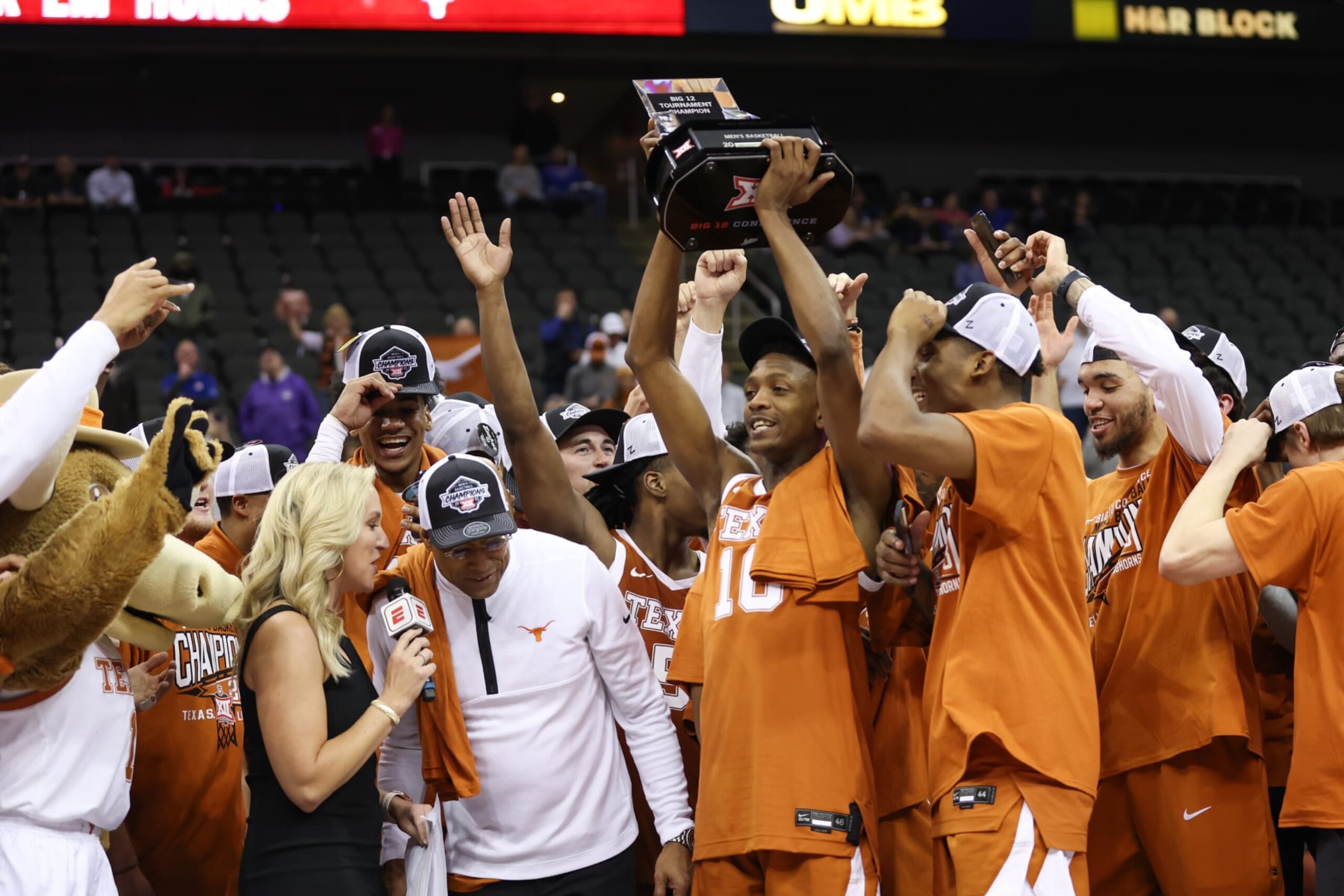 KANSAS CITY, MO - MARCH 11: Texas Longhorns guard Sir'Jabari Rice (10) holds up the championship trophy after the Big 12 basketball tournament championship game between the Texas Longhorns and Kansas Jayhawks on March 11, 2023 at T-Mobile Center in Kansas City, MO. (Photo by Scott Winters/Icon Sportswire via Getty Images)