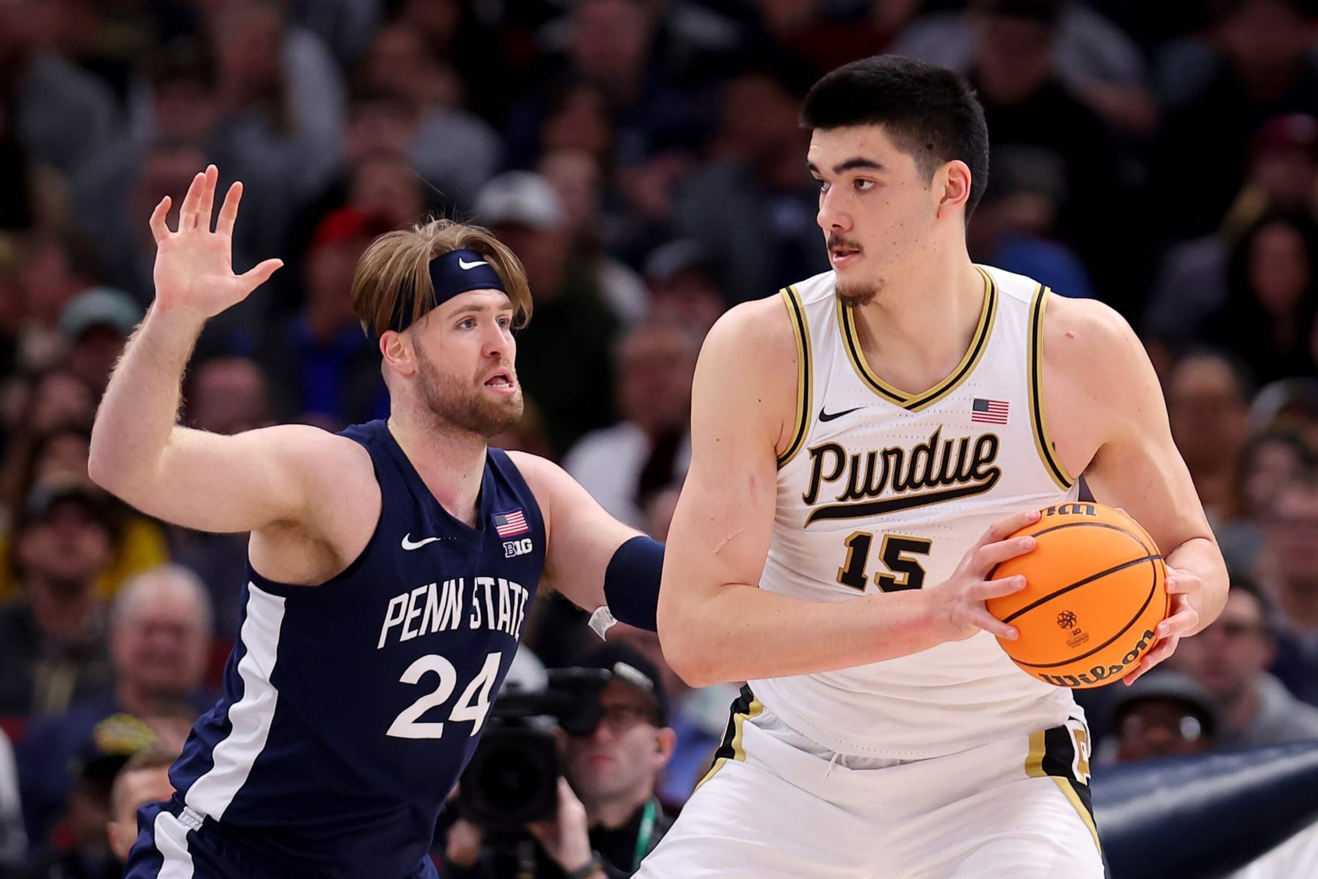 CHICAGO, ILLINOIS - MARCH 12: Zach Edey #15 of the Purdue Boilermakers looks to pass against Michael Henn #24 of the Penn State Nittany Lions during the first half in the Big Ten Basketball Tournament Championship game at United Center on March 12, 2023 in Chicago, Illinois. (Photo by Michael Reaves/Getty Images)