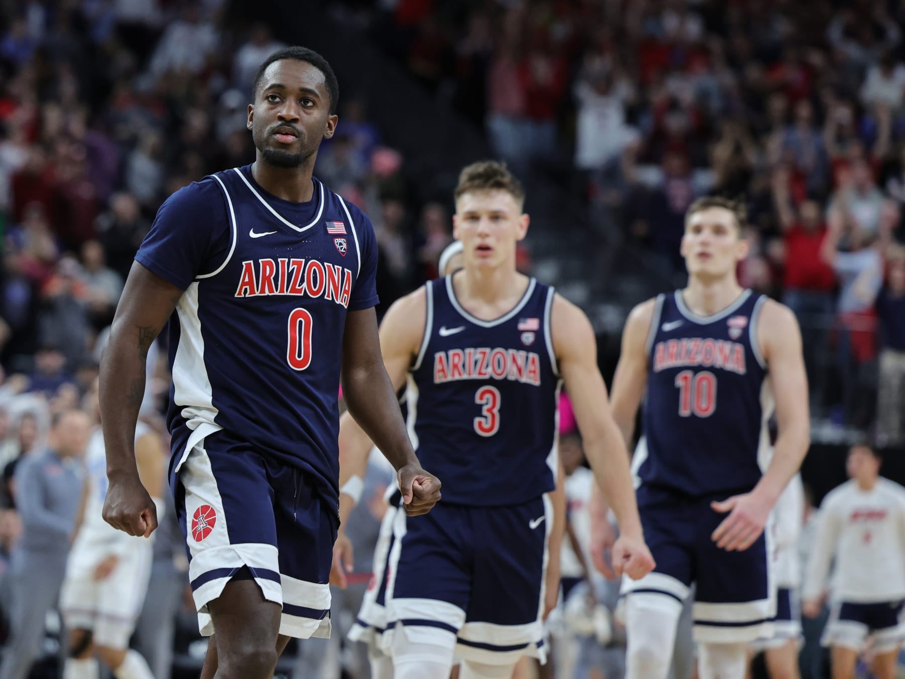 LAS VEGAS, NEVADA - MARCH 11: Courtney Ramey #0 of the Arizona Wildcats reacts after hitting a 3-pointer against the UCLA Bruins to put the Wildcats up for good late in the second half of the championship game of the Pac-12 basketball tournament at T-Mobile Arena on March 11, 2023 in Las Vegas, Nevada. The Wildcats defeated the Bruins 61-59. (Photo by Ethan Miller/Getty Images)