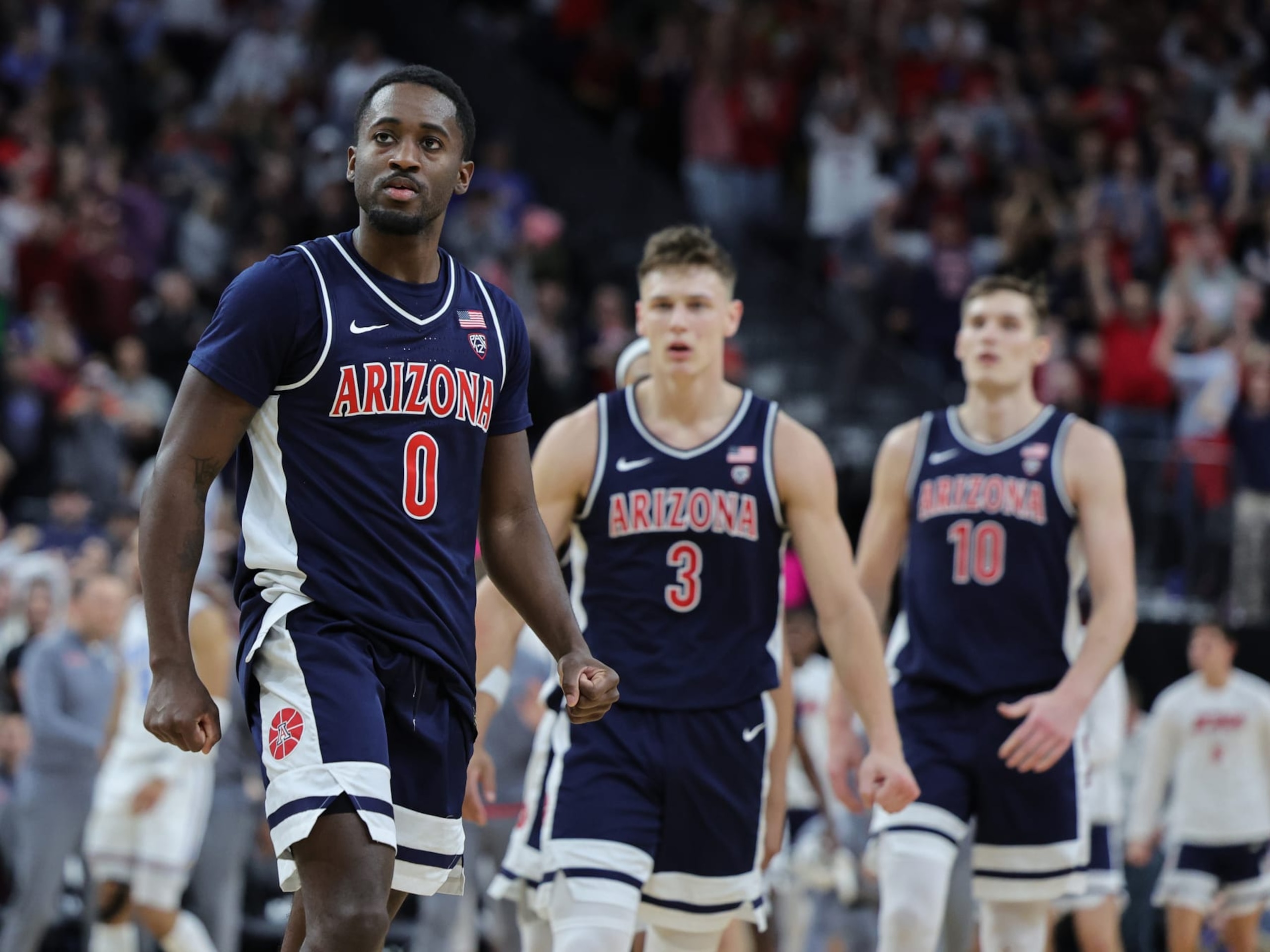 LAS VEGAS, NEVADA - MARCH 11: Courtney Ramey #0 of the Arizona Wildcats reacts after hitting a 3-pointer against the UCLA Bruins to put the Wildcats up for good late in the second half of the championship game of the Pac-12 basketball tournament at T-Mobile Arena on March 11, 2023 in Las Vegas, Nevada. The Wildcats defeated the Bruins 61-59. (Photo by Ethan Miller/Getty Images)