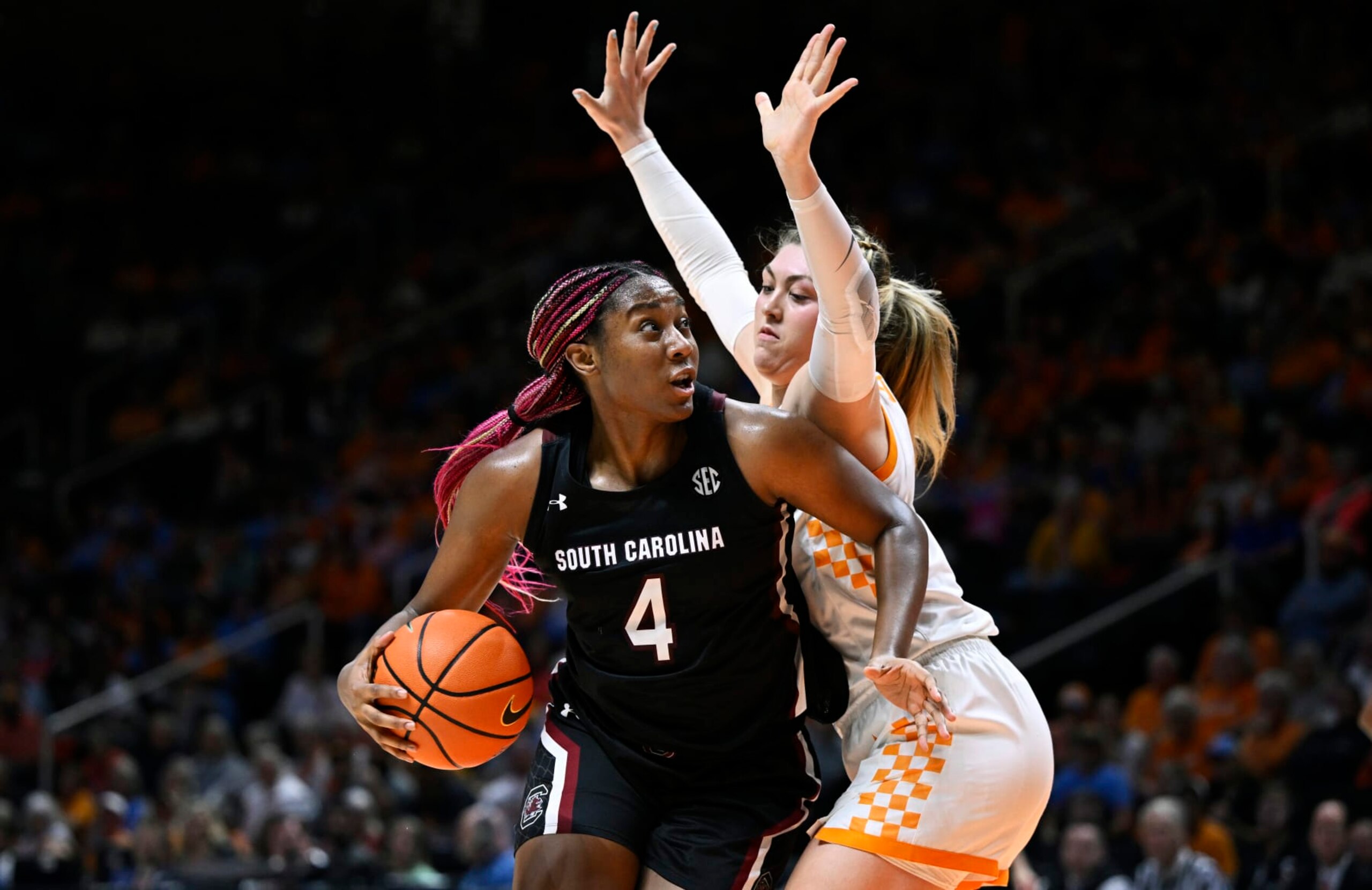 KNOXVILLE, TENNESSEE - FEBRUARY 23: Aliyah Boston #4 of the South Carolina Gamecocks dribbles against Karoline Striplin #11 of the Tennessee Lady Vols in the fourth quarter at Thompson-Boling Arena on February 23, 2023 in Knoxville, Tennessee. (Photo by Eakin Howard/Getty Images)