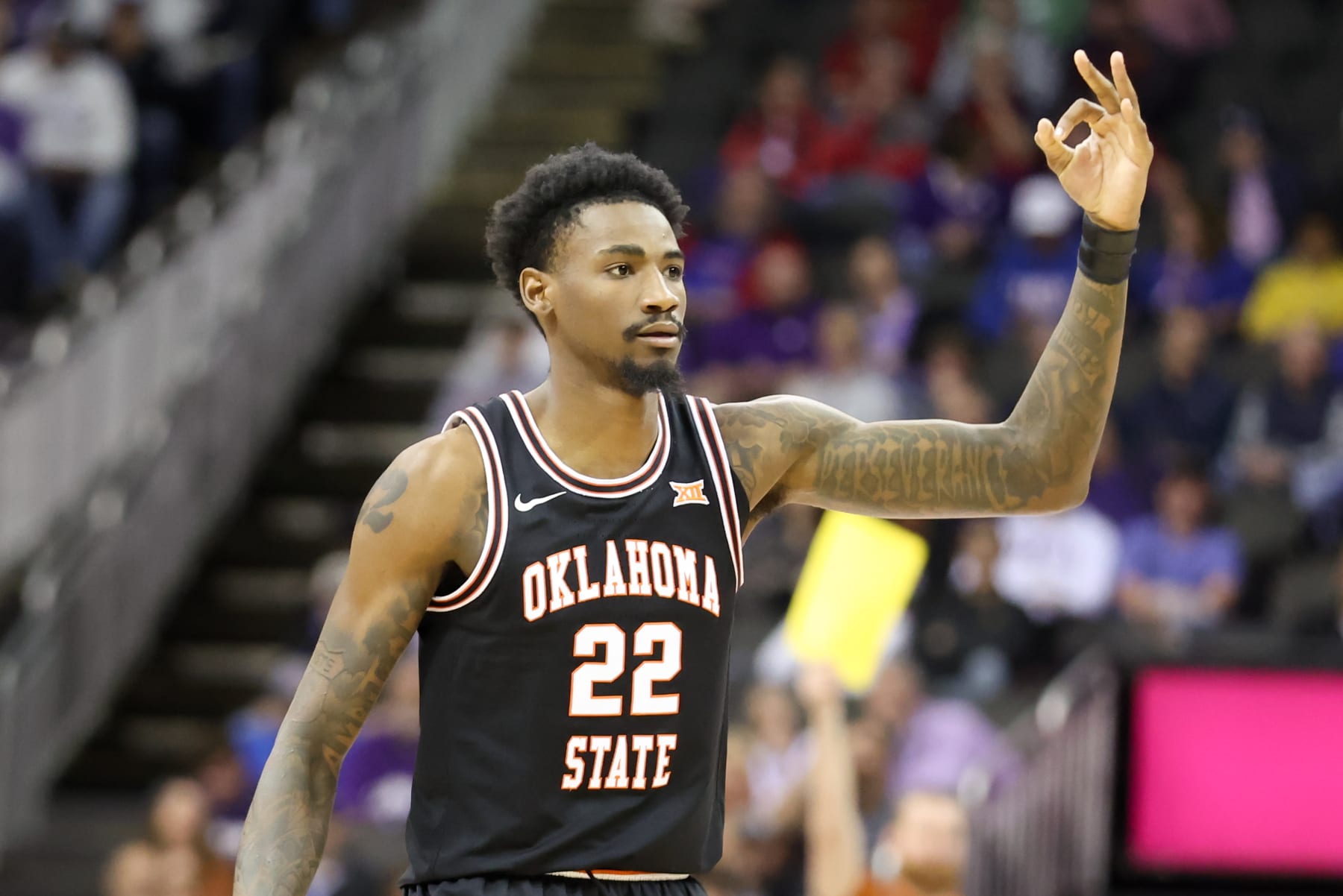 KANSAS CITY, MO - MARCH 09: Oklahoma State Cowboys forward Kalib Boone (22) signals three after making a basket in the second half of a Big 12 Tournament quarterfinal basketball game between the Oklahoma State Cowboys and Texas Longhorns on March 9, 2023 at T-Mobile Center in Kansas City, MO. (Photo by Scott Winters/Icon Sportswire via Getty Images)