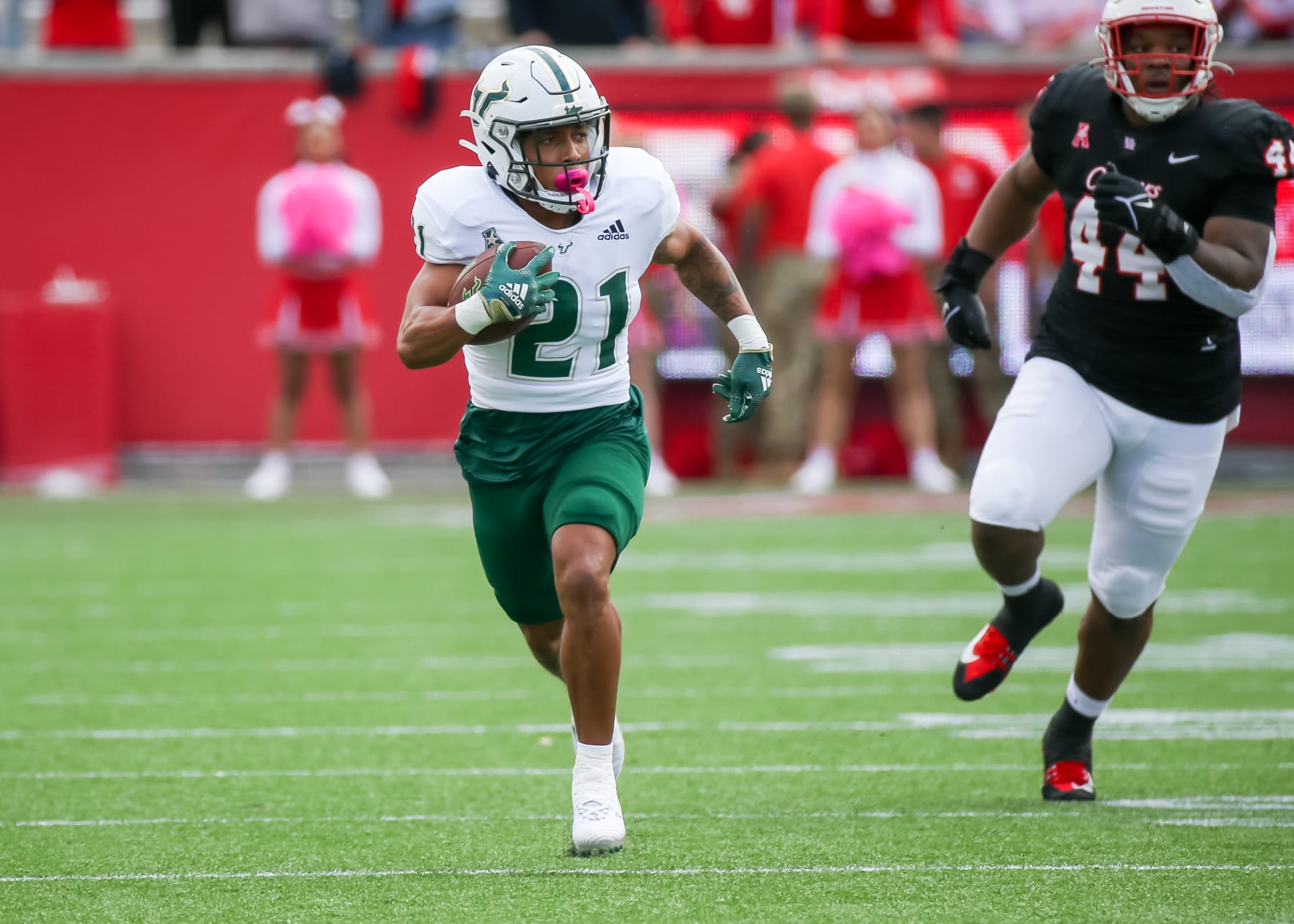 HOUSTON, TX - OCTOBER 29:  South Florida Bulls running back Brian Battie (21) carries the ball in the first quarter during the college football game between the South Florida Bulls and Houston Cougars on October 29, 2022 at TDECU Stadium in Houston, Texas.  (Photo by Leslie Plaza Johnson/Icon Sportswire via Getty Images)