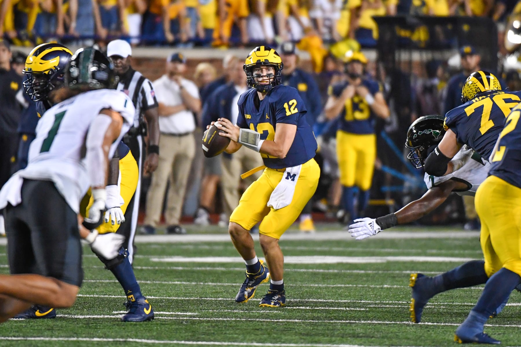 ANN ARBOR, MICHIGAN - SEPTEMBER 10: Cade McNamara #12 of the Michigan Wolverines looks to throw the ball during the first half of a college football game against the Hawaii Rainbow Warriors at Michigan Stadium on September 10, 2022 in Ann Arbor, Michigan. (Photo by Aaron J. Thornton/Getty Images)
