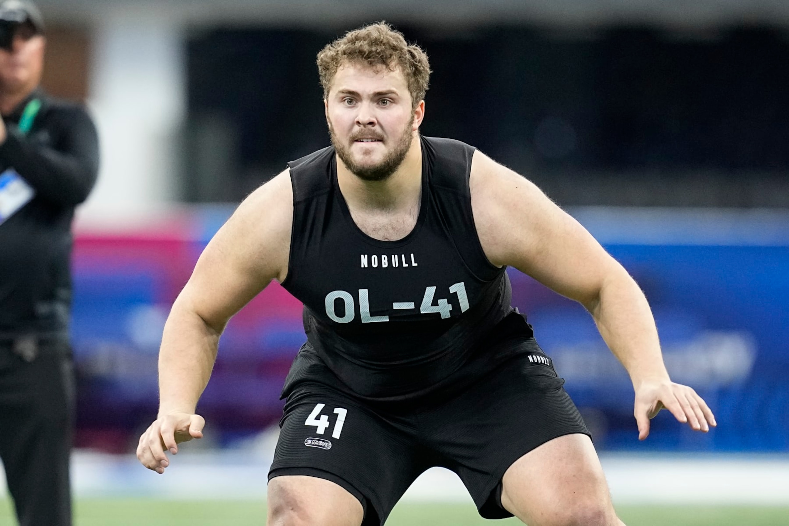 Northwestern offensive lineman Peter Skoronski runs a drill at the NFL football scouting combine in Indianapolis, Sunday, March 5, 2023. (AP Photo/Darron Cummings)