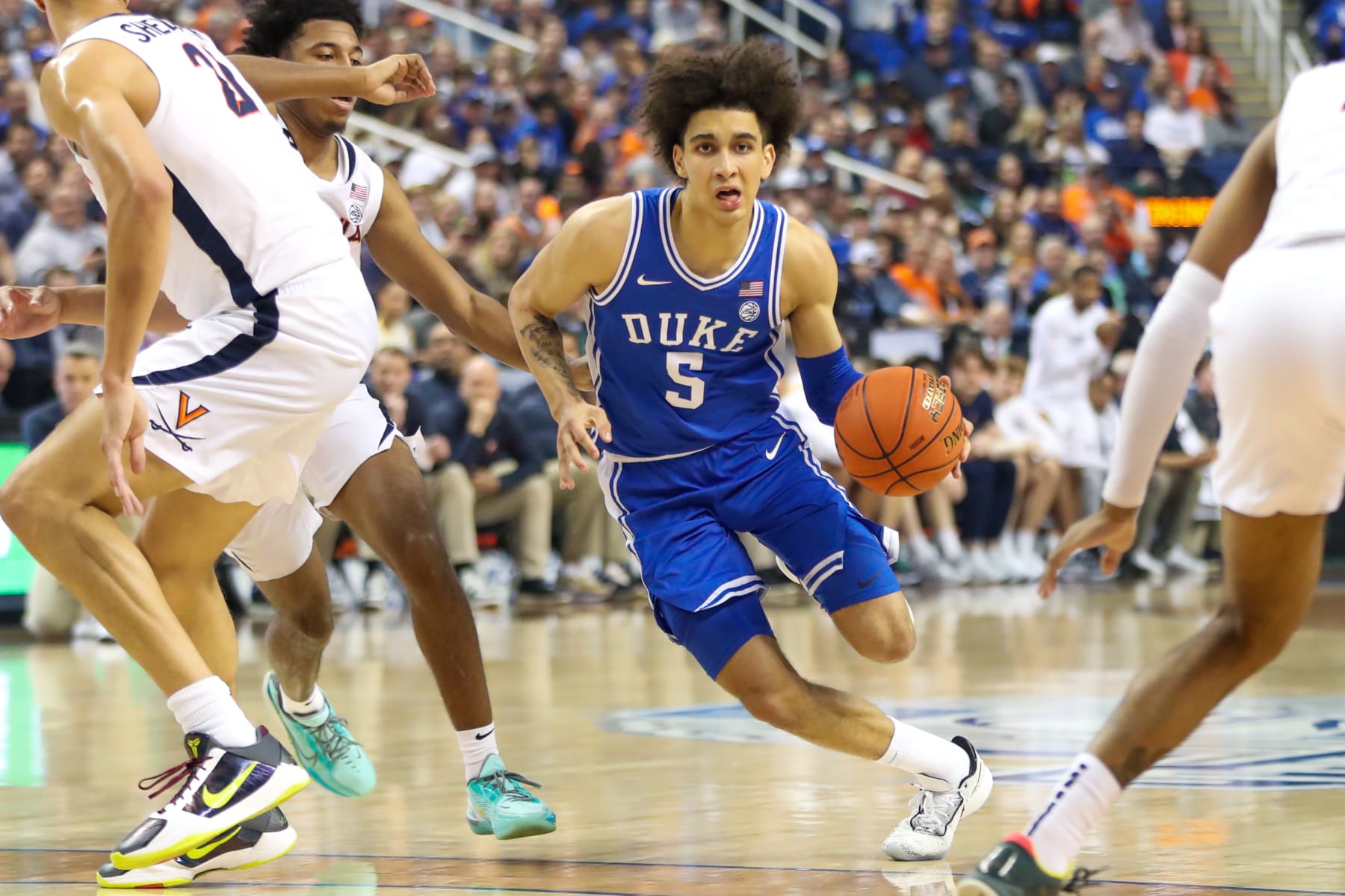 GREENSBORO, NC - MARCH 11: Tyrese Proctor (5) of the Duke Blue Devils drives to the basket during the ACC Championship against the Virginia Cavaliers on March 11, 2023 at Greensboro Coliseum in Greensboro, NC. (Photo by David Jensen/Icon Sportswire via Getty Images)