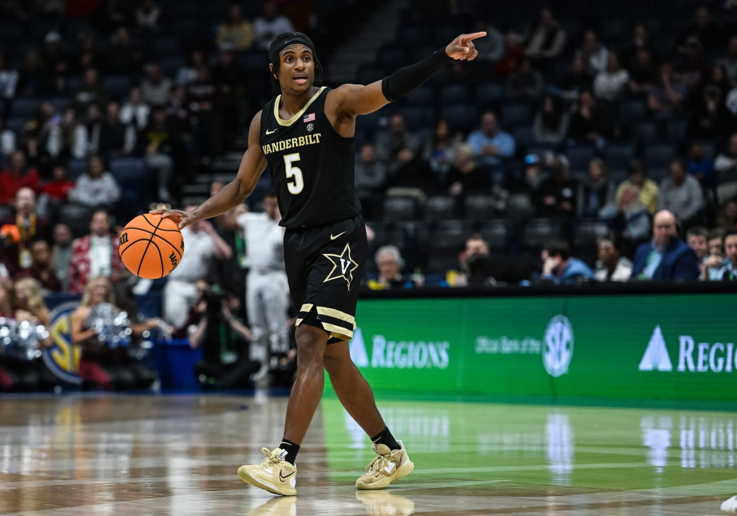 NASHVILLE, TN - MARCH 11: Vanderbilt Commodores guard Ezra Manjon (5) controls the ball during an SEC Mens Basketball Tournament game between the Texas A&M Aggies and the Vanderbilt Commodores on March 11, 2023 at Bridgestone Arena in Nashville, TN. (Photo by Bryan Lynn/Icon Sportswire via Getty Images)