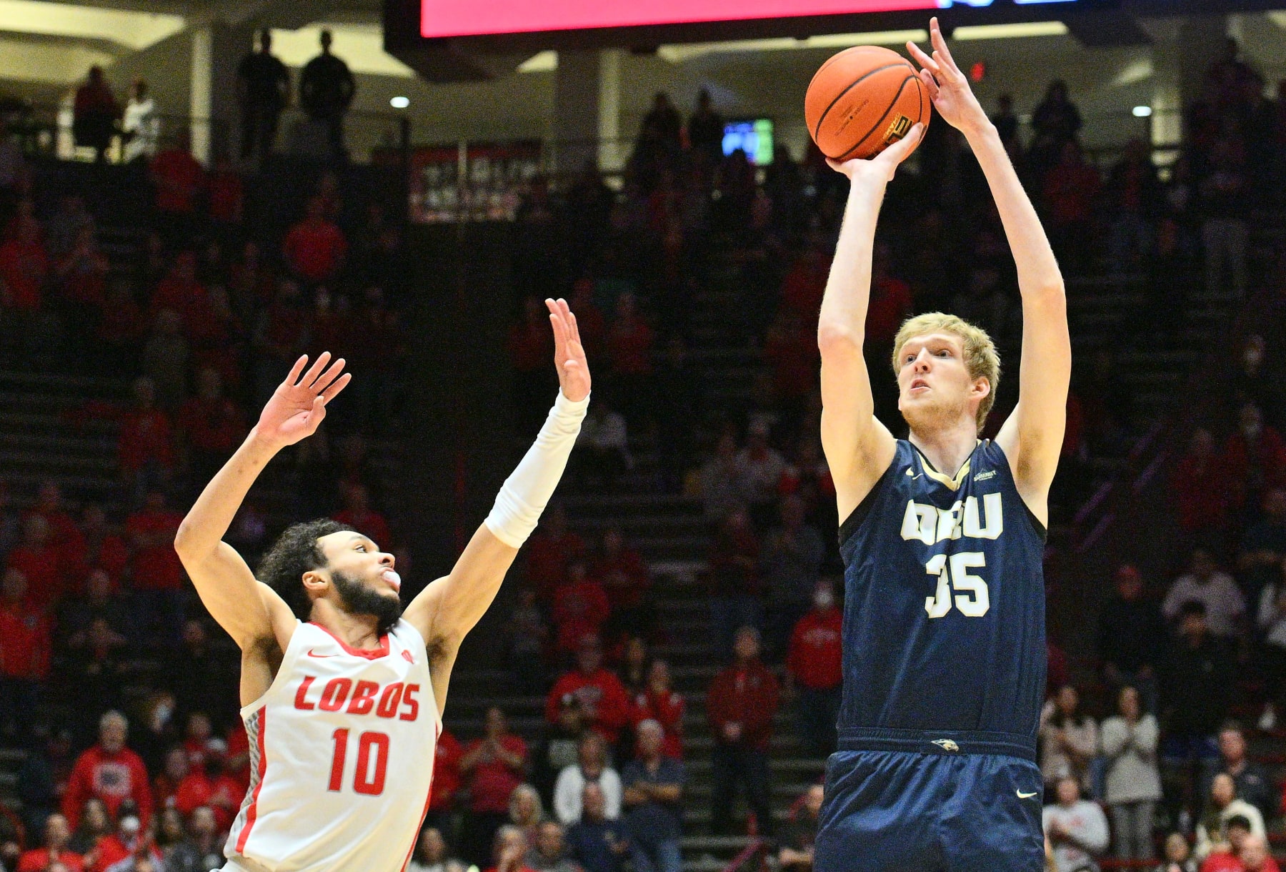 ALBUQUERQUE, NEW MEXICO - JANUARY 09: Connor Vanover #35 of the Oral Roberts Golden Eagles shoots a 3-pointer against Jaelen House #10 of the New Mexico Lobos during the first half of their game at The Pit on January 09, 2023 in Albuquerque, New Mexico. (Photo by Sam Wasson/Getty Images)