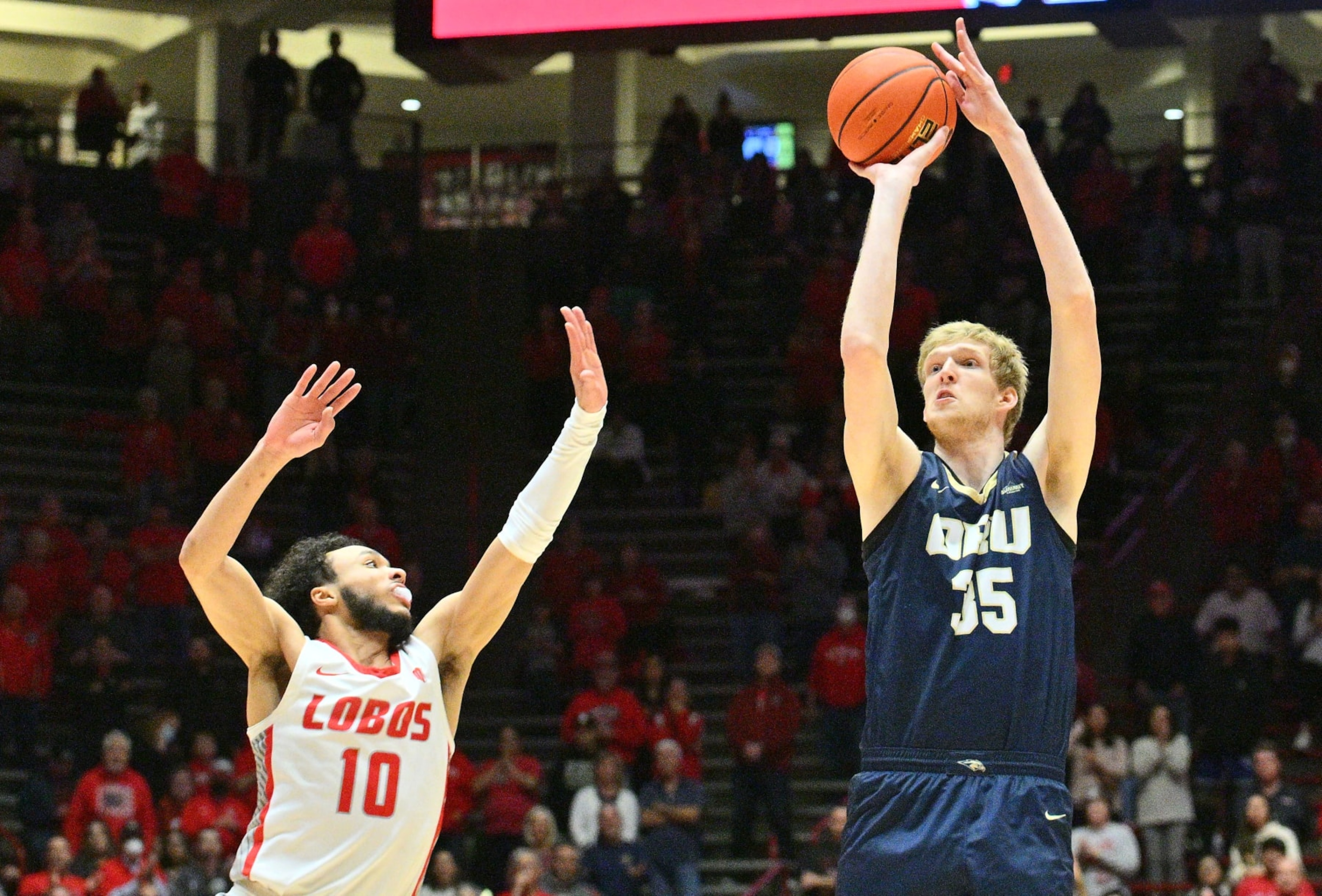 ALBUQUERQUE, NEW MEXICO - JANUARY 09: Connor Vanover #35 of the Oral Roberts Golden Eagles shoots a 3-pointer against Jaelen House #10 of the New Mexico Lobos during the first half of their game at The Pit on January 09, 2023 in Albuquerque, New Mexico. (Photo by Sam Wasson/Getty Images)