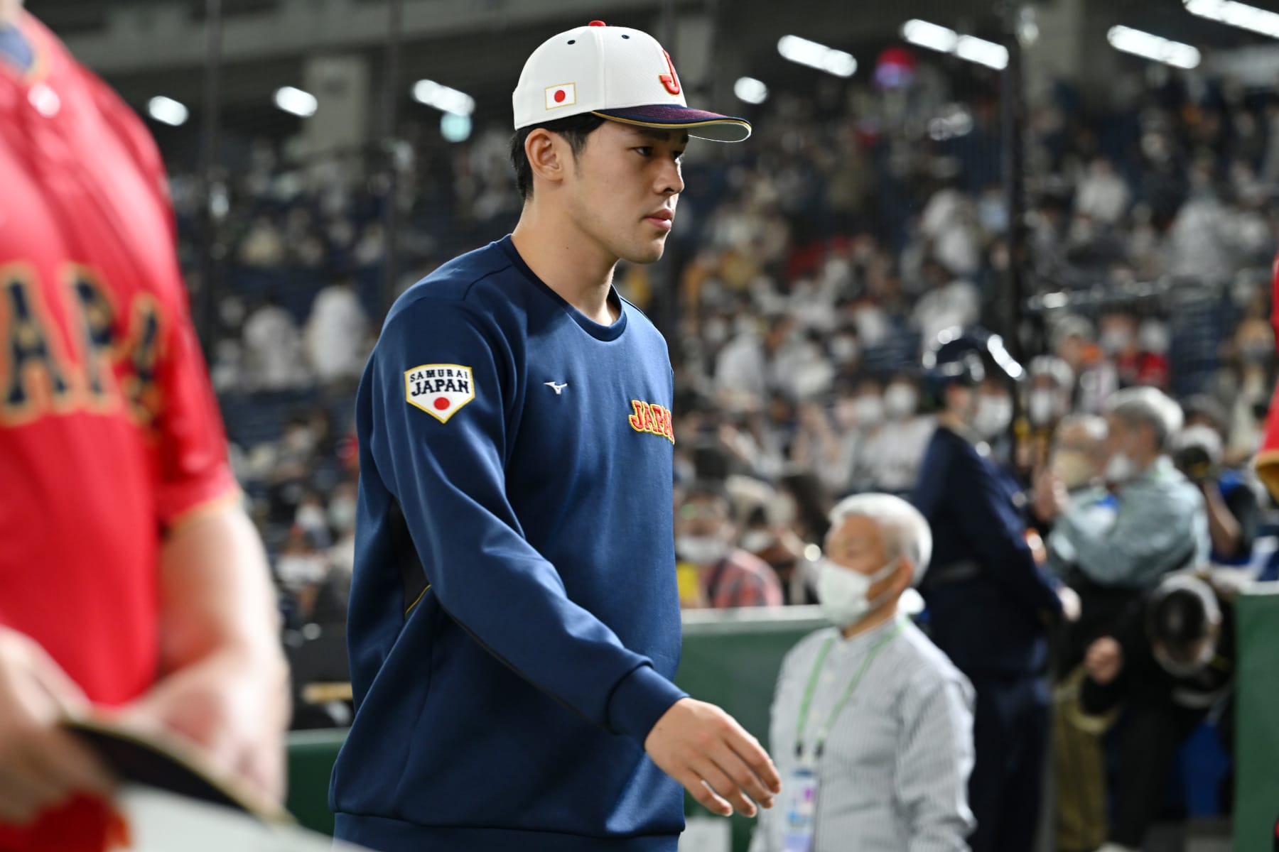 TOKYO, JAPAN - MARCH 11: Roki Sasaki #14 of Japan is seen after observing a minute of silence for the victims of the Great East Japan Earthquake on the 12th anniversary prior to the World Baseball Classic Pool B game between Czech Republic and Japan at Tokyo Dome on March 11, 2023 in Tokyo, Japan. Sasaki lost his father and grand parents. (Photo by Kenta Harada/Getty Images)