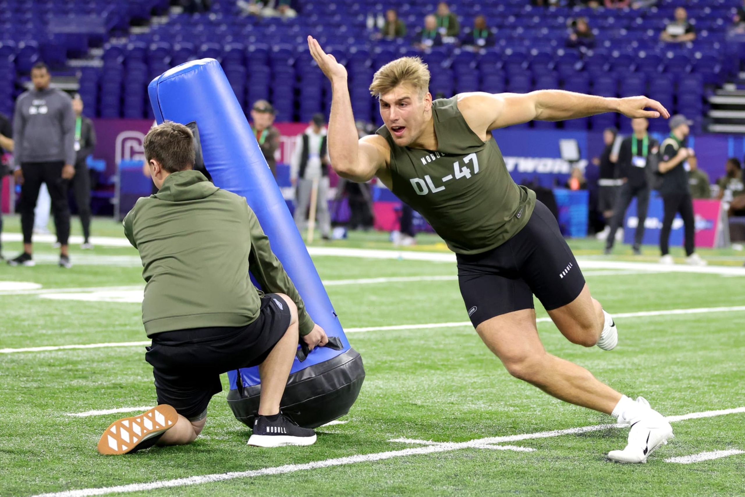 INDIANAPOLIS, INDIANA - MARCH 02: Defensive lineman Lukas Van Ness of Iowa participates in a drill during the NFL Combine at Lucas Oil Stadium on March 02, 2023 in Indianapolis, Indiana. (Photo by Stacy Revere/Getty Images)