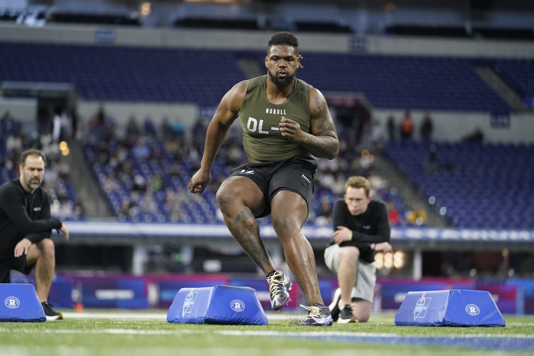 South Carolina defensive lineman Zacch Pickens runs a drill at the NFL football scouting combine in Indianapolis, Thursday, March 2, 2023. (AP Photo/Michael Conroy)