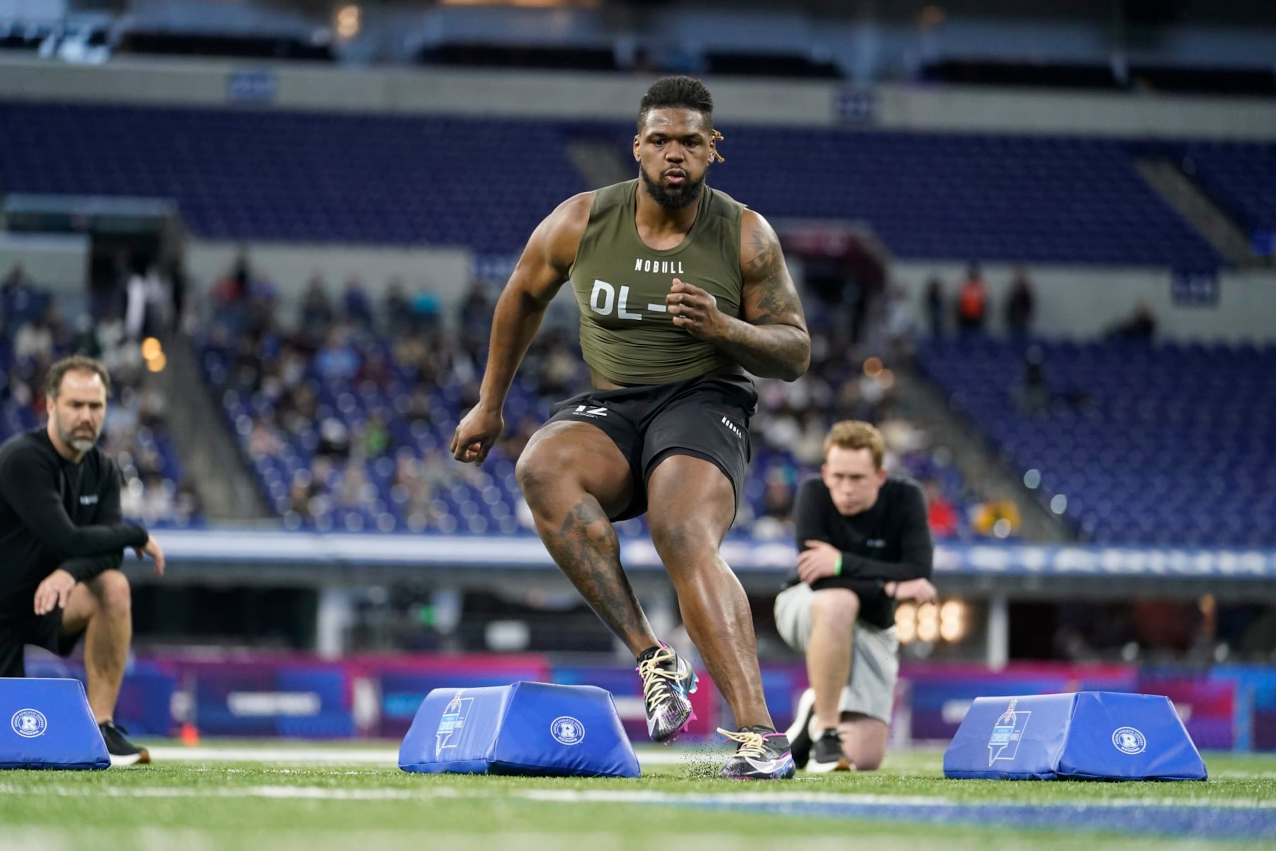 South Carolina defensive lineman Zacch Pickens runs a drill at the NFL football scouting combine in Indianapolis, Thursday, March 2, 2023. (AP Photo/Michael Conroy)