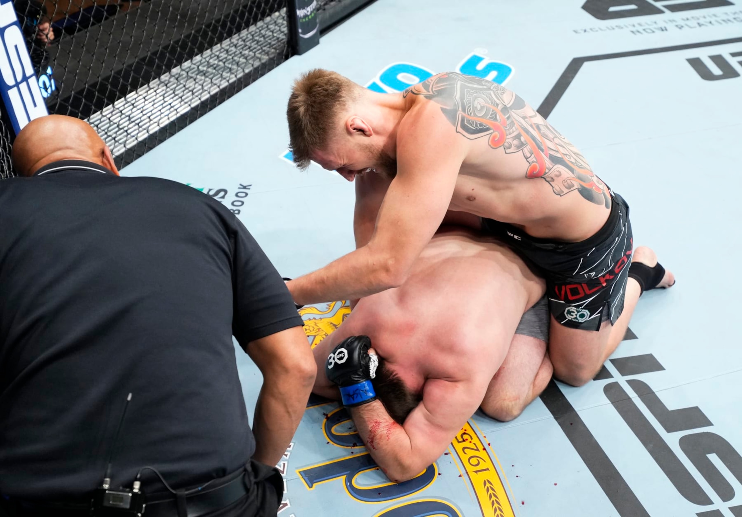 Alexander Volkov beats Alexandr Romanov by TKO. 