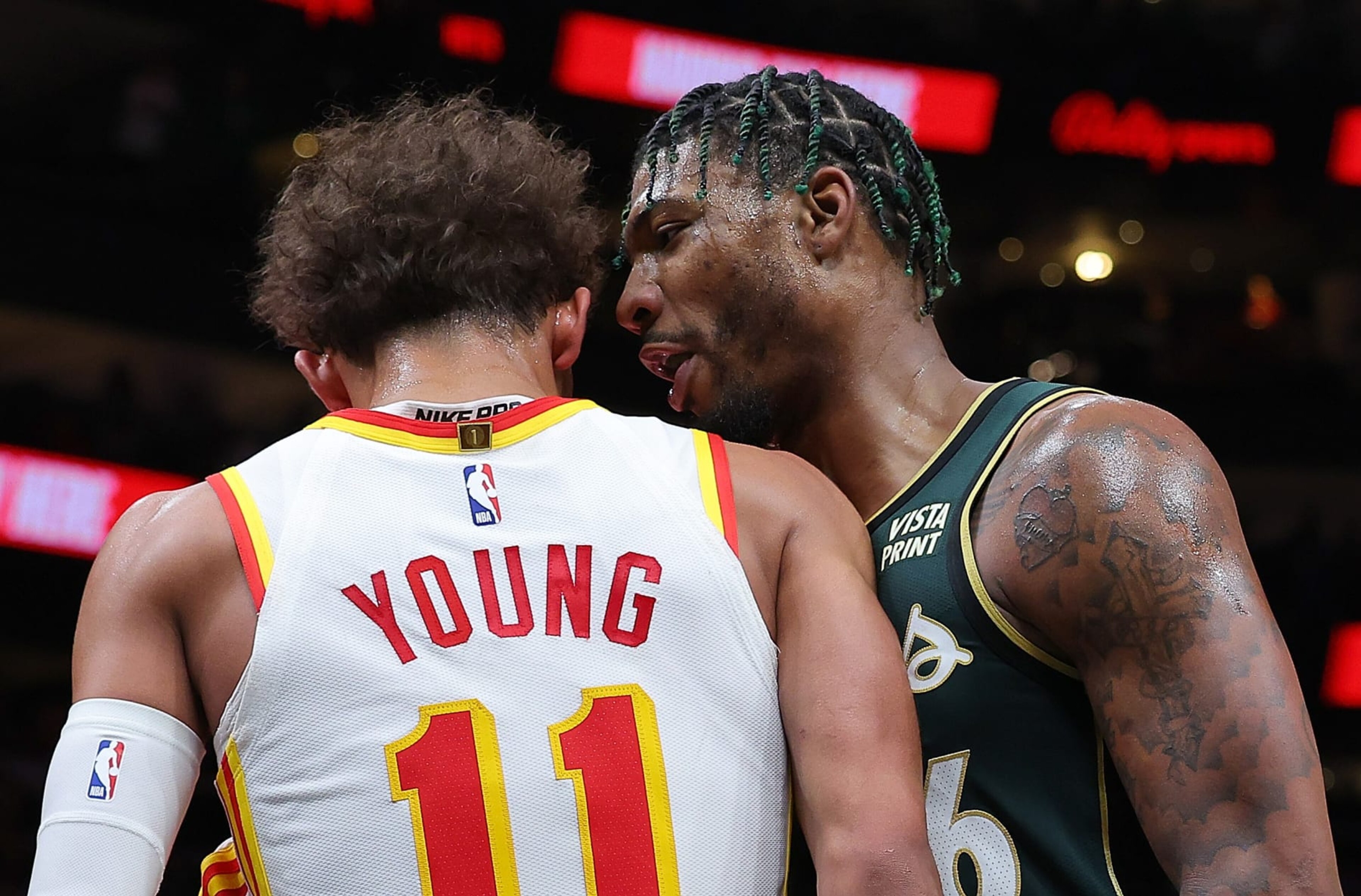 ATLANTA, GEORGIA - MARCH 11:  Marcus Smart #36 of the Boston Celtics confronts Trae Young #11 of the Atlanta Hawks prior to an altercation where they both fall to the floor during the fourth quarter at State Farm Arena on March 11, 2023 in Atlanta, Georgia.  After a video review, Young was issued a technical foul and Smart was issued a technical foul and ejected from the game. 
 NOTE TO USER: User expressly acknowledges and agrees that, by downloading and or using this photograph, User is consenting to the terms and conditions of the Getty Images License Agreement.  (Photo by Kevin C. Cox/Getty Images)