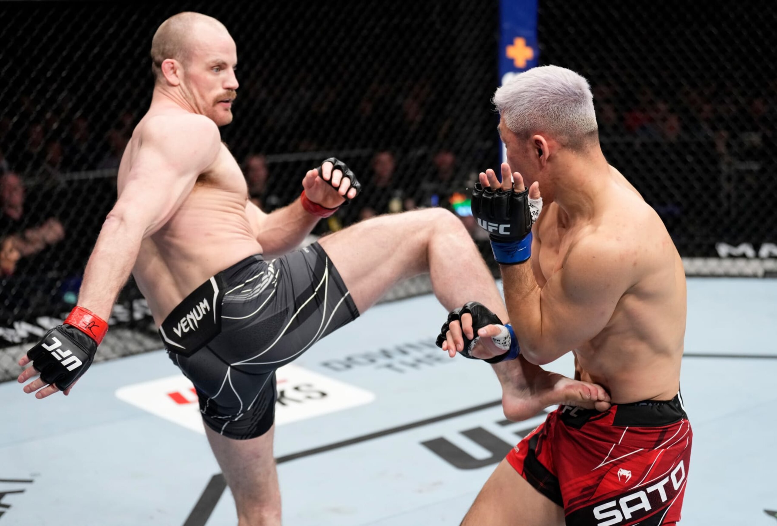 Gunnar Nelson kicks Takashi Sato