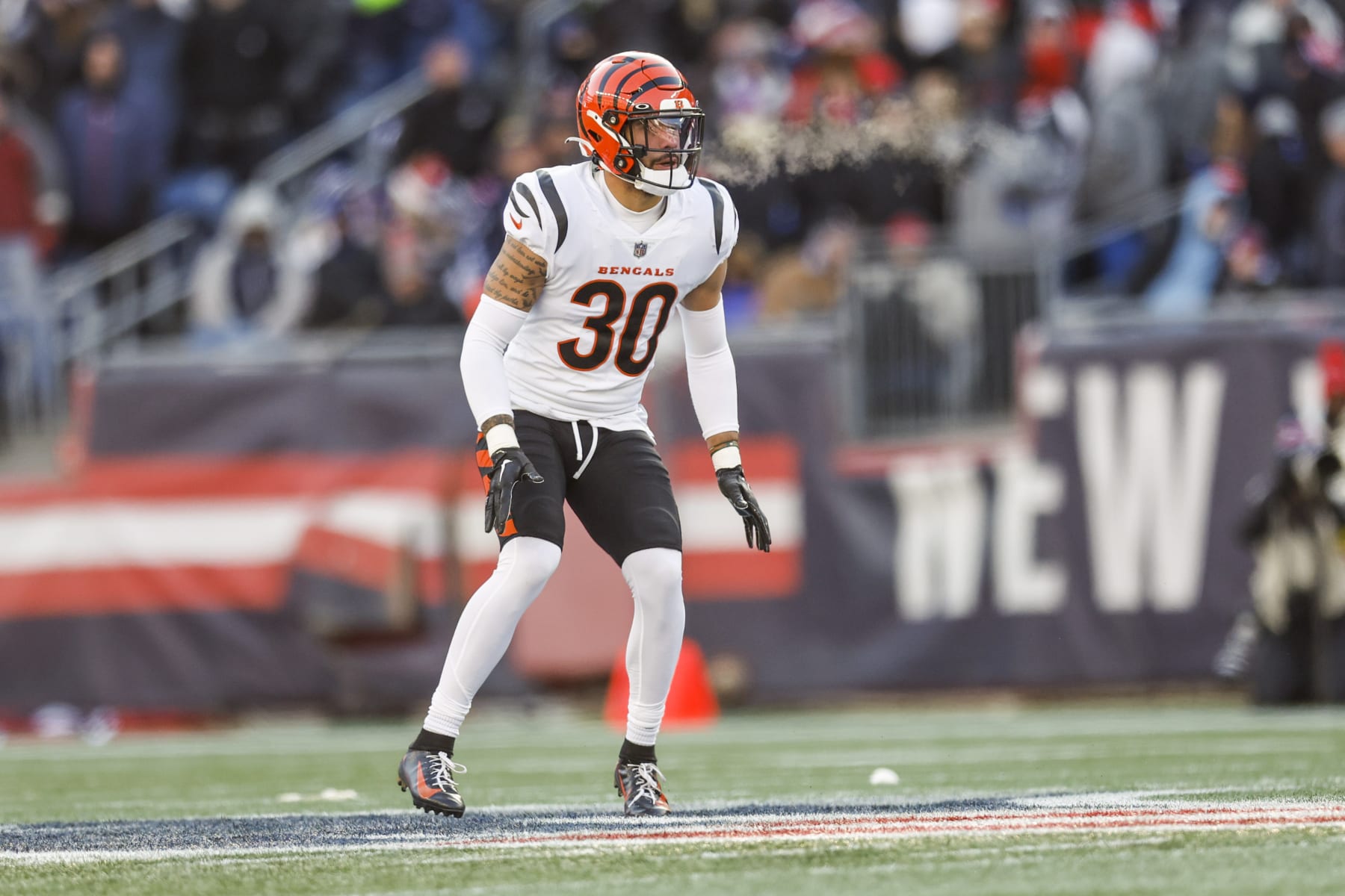 Cincinnati Bengals safety Jessie Bates III (30) exhales into the cold air during the first half of an NFL football game against the New England Patriots, Saturday, Dec. 24, 2022, in Foxborough, Mass. (AP Photo/Greg M. Cooper)