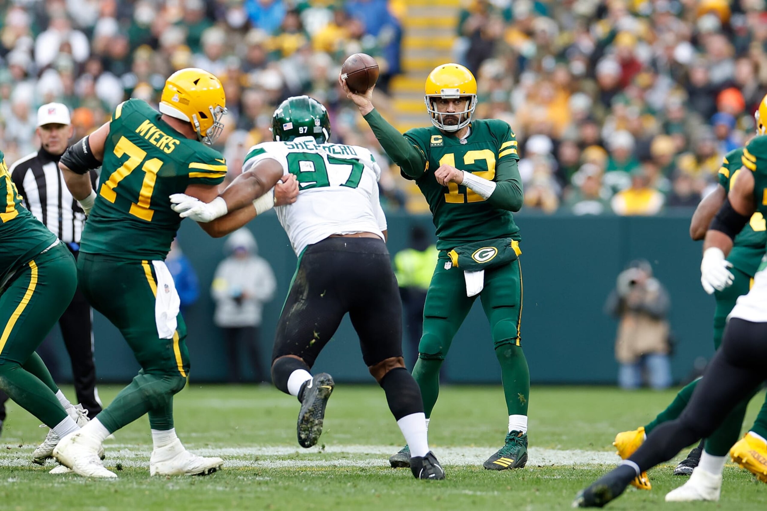 GREEN BAY, WISCONSIN - OCTOBER 16: Aaron Rodgers #12 of the Green Bay Packers throws a pass against the New York Jets at Lambeau Field on October 16, 2022 in Green Bay, Wisconsin. Jets defeated the Packers 27-10. (Photo by John Fisher/Getty Images)