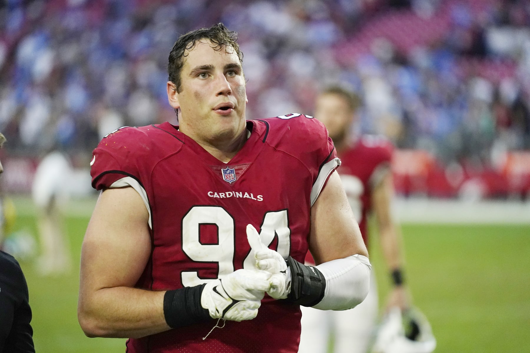 Arizona Cardinals defensive end Zach Allen walks off the field after an NFL football game against the Los Angeles Chargers in Glendale, Ariz., Sunday, Nov. 27, 2022. The Chargers won 25-24. (AP Photo/Ross D. Franklin)