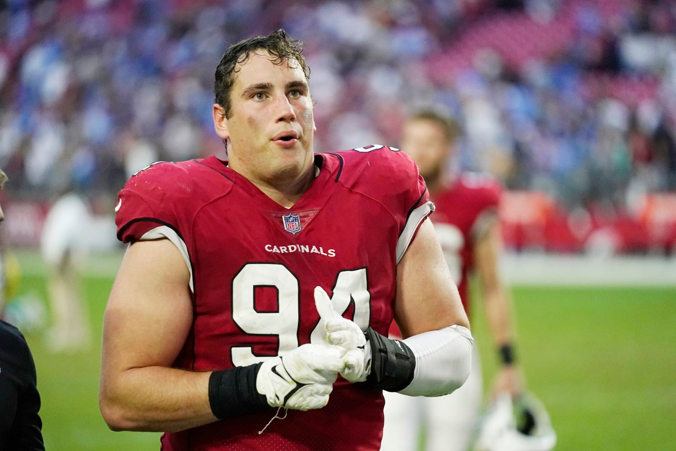 Arizona Cardinals defensive end Zach Allen walks off the field after an NFL football game against the Los Angeles Chargers in Glendale, Ariz., Sunday, Nov. 27, 2022. The Chargers won 25-24. (AP Photo/Ross D. Franklin)