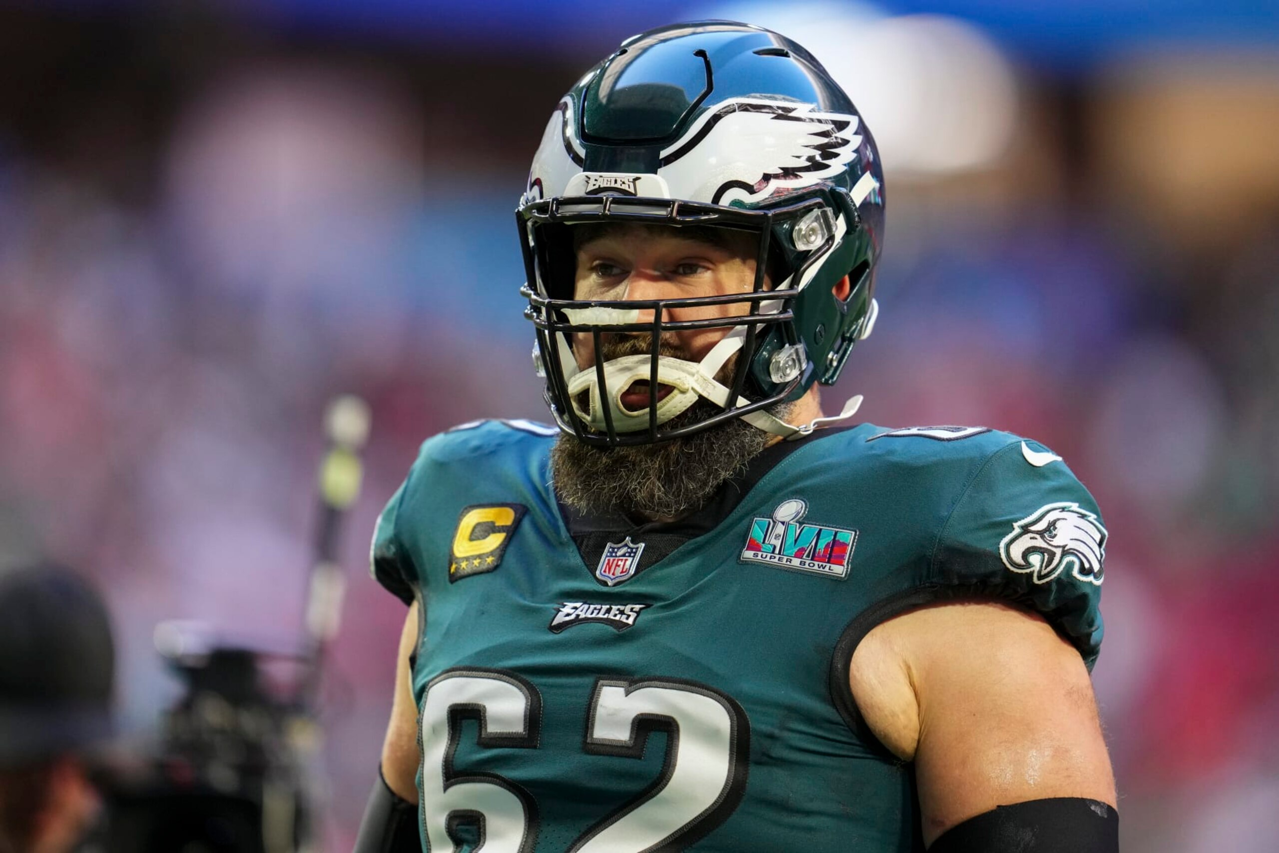 GLENDALE, AZ - FEBRUARY 12: Jason Kelce #62 of the Philadelphia Eagles speaks with teammates against the Kansas City Chiefs after Super Bowl LVII at State Farm Stadium on February 12, 2023 in Glendale, Arizona. The Chiefs defeated the Eagles 38-35. (Photo by Cooper Neill/Getty Images)