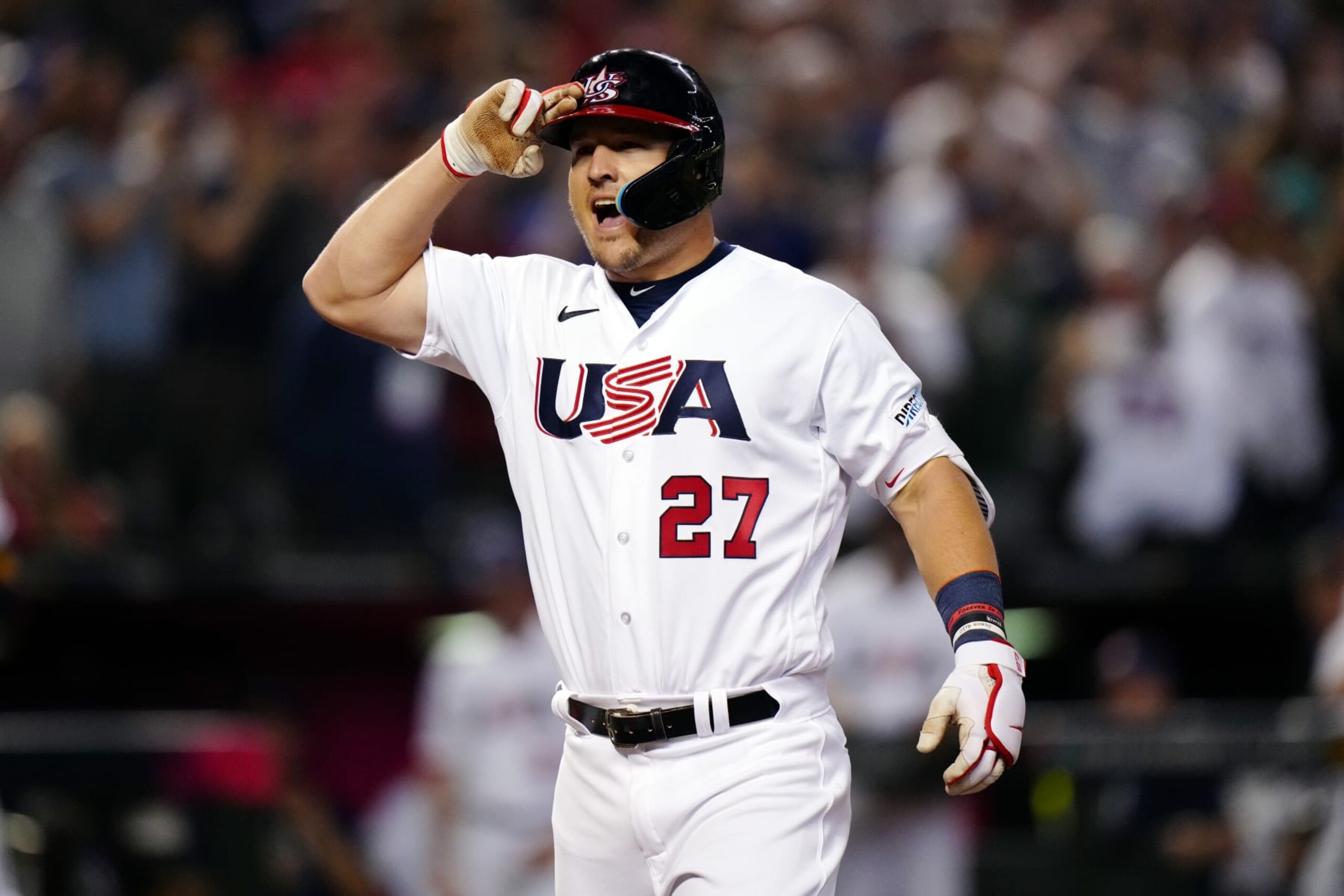 PHOENIX, AZ - MARCH 13:  Mike Trout #27 of Team USA crosses home plate and salutes after hitting a three-run home run in the first inning during Game 6 of Pool C between Team Canada and Team USA at Chase Field on Monday, March 13, 2023 in Phoenix, Arizona. (Photo by Daniel Shirey/WBCI/MLB Photos via Getty Images)