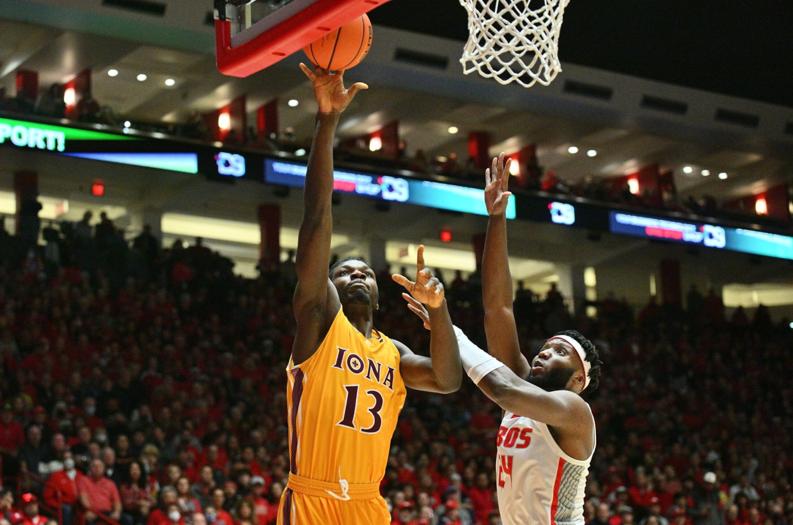 ALBUQUERQUE, NEW MEXICO - DECEMBER 18: Nelly Junior Joseph #13 of the Iona Gaels shoots against Morris Udeze #24 of the New Mexico Lobos during the first half of their game at The Pit on December 18, 2022 in Albuquerque, New Mexico. (Photo by Sam Wasson/Getty Images)