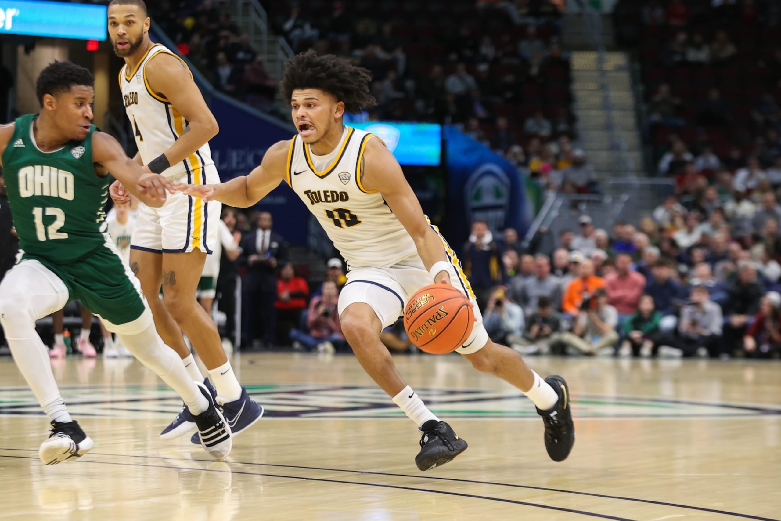 CLEVELAND, OH - MARCH 10: Toledo Rockets guard RayJ Dennis (10) drives to the basket during the second half of the MAC Mens Basketball Tournament Semifinal game between the Ohio Bobcats and Toledo Rockets on March 10, 2023, at Rocket Mortgage FieldHouse in Cleveland, OH. (Photo by Frank Jansky/Icon Sportswire via Getty Images)