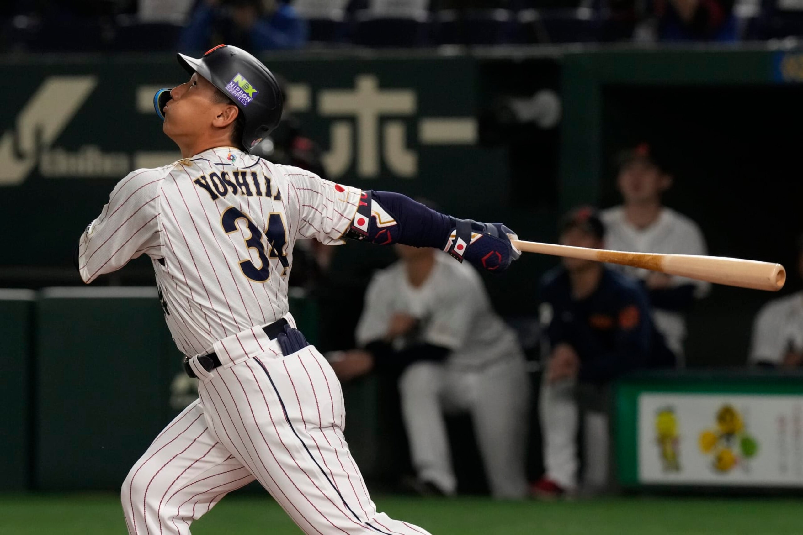 Masataka Yoshida of Japan flies out in the first inning of the Pool B game against China, at the World Baseball Classic (WBC) in Tokyo, Japan, Thursday, March 9, 2023.(AP Photo/Eugene Hoshiko)