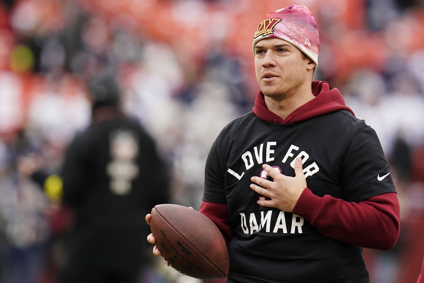 LANDOVER, MARYLAND - JANUARY 08:  Quarterback Taylor Heinicke #4 of the Washington Commanders warms up prior tot he game against the Dallas Cowboys at FedExField on January 08, 2023 in Landover, Maryland. (Photo by Jess Rapfogel/Getty Images)