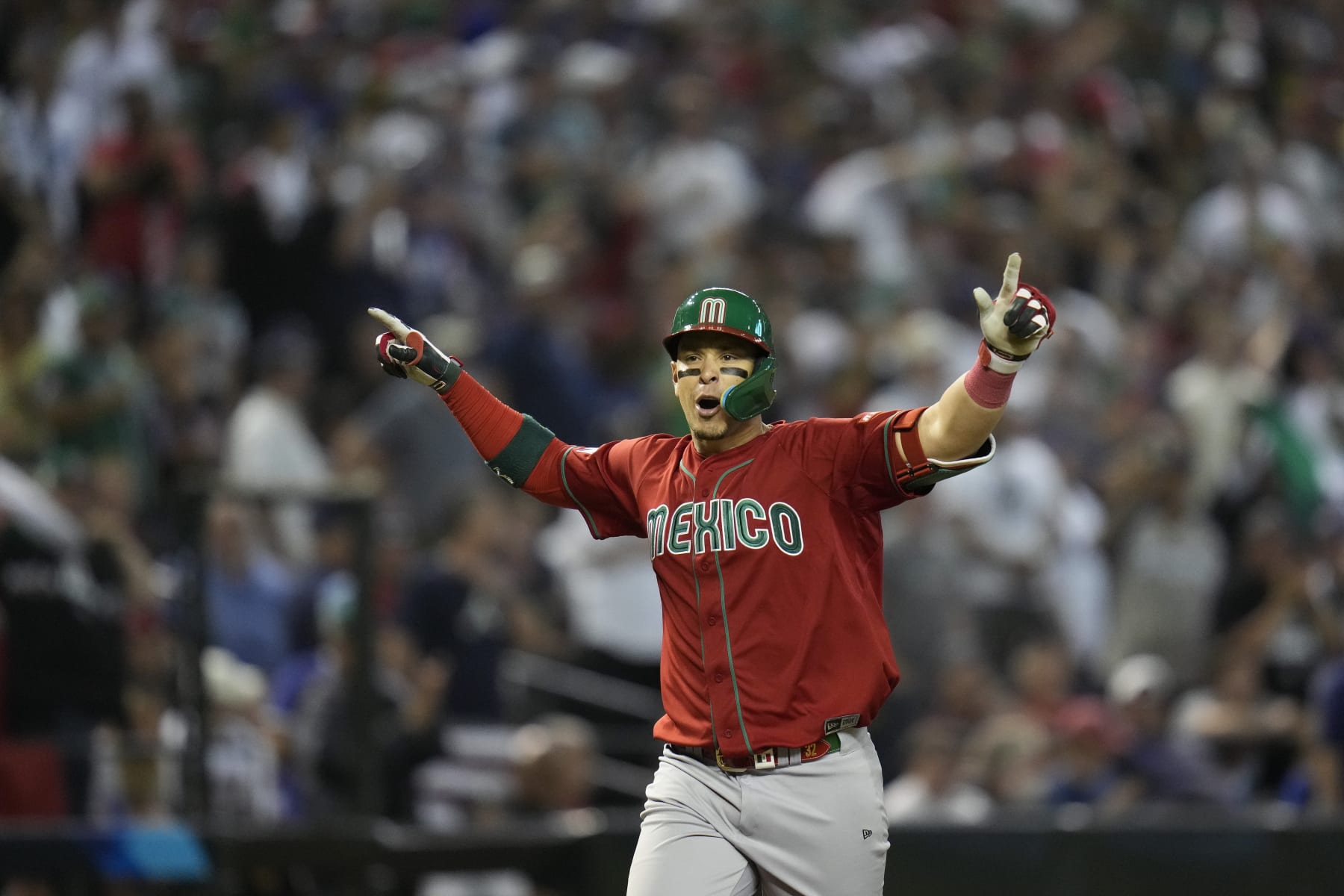 Mexico's Joey Meneses celebrates as he runs the bases after hitting a three-run home run against the United States during the fourth inning of a World Baseball Classic game in Phoenix, Sunday, March 12, 2023. (AP Photo/Godofredo A. Vásquez)