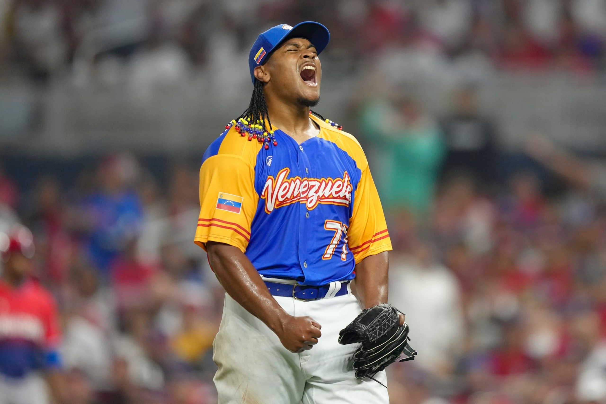 MIAMI, FLORIDA - MARCH 11: Luis Garcia #77 of Venezuela reacts after striking out Teoscar Hernandez #37 of the Dominican Republic during the seventh inning at loanDepot park on March 11, 2023 in Miami, Florida. (Photo by Eric Espada/Getty Images)