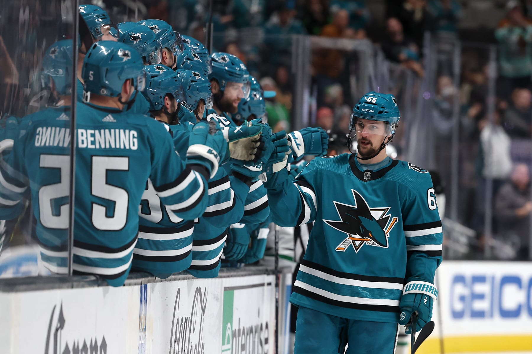 SAN JOSE, CALIFORNIA - JANUARY 18: Erik Karlsson #65 of the San Jose Sharks is congratulated by teammates after he scored a goal against the Dallas Stars in the third period at SAP Center on January 18, 2023 in San Jose, California. (Photo by Ezra Shaw/Getty Images)