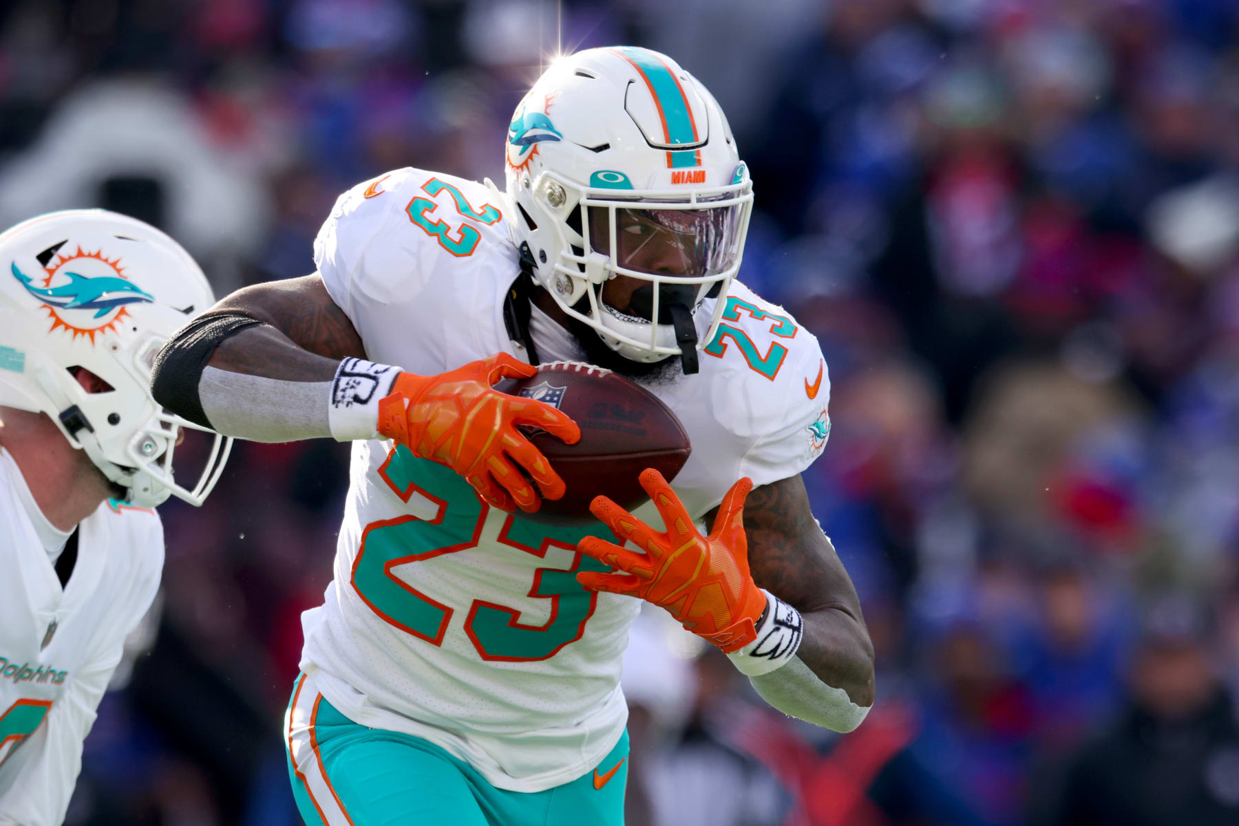 ORCHARD PARK, NEW YORK - JANUARY 15: Jeff Wilson Jr. #23 of the Miami Dolphins carries the ball against the Buffalo Bills during the first half of the game in the AFC Wild Card playoff game at Highmark Stadium on January 15, 2023 in Orchard Park, New York. (Photo by Bryan M. Bennett/Getty Images)