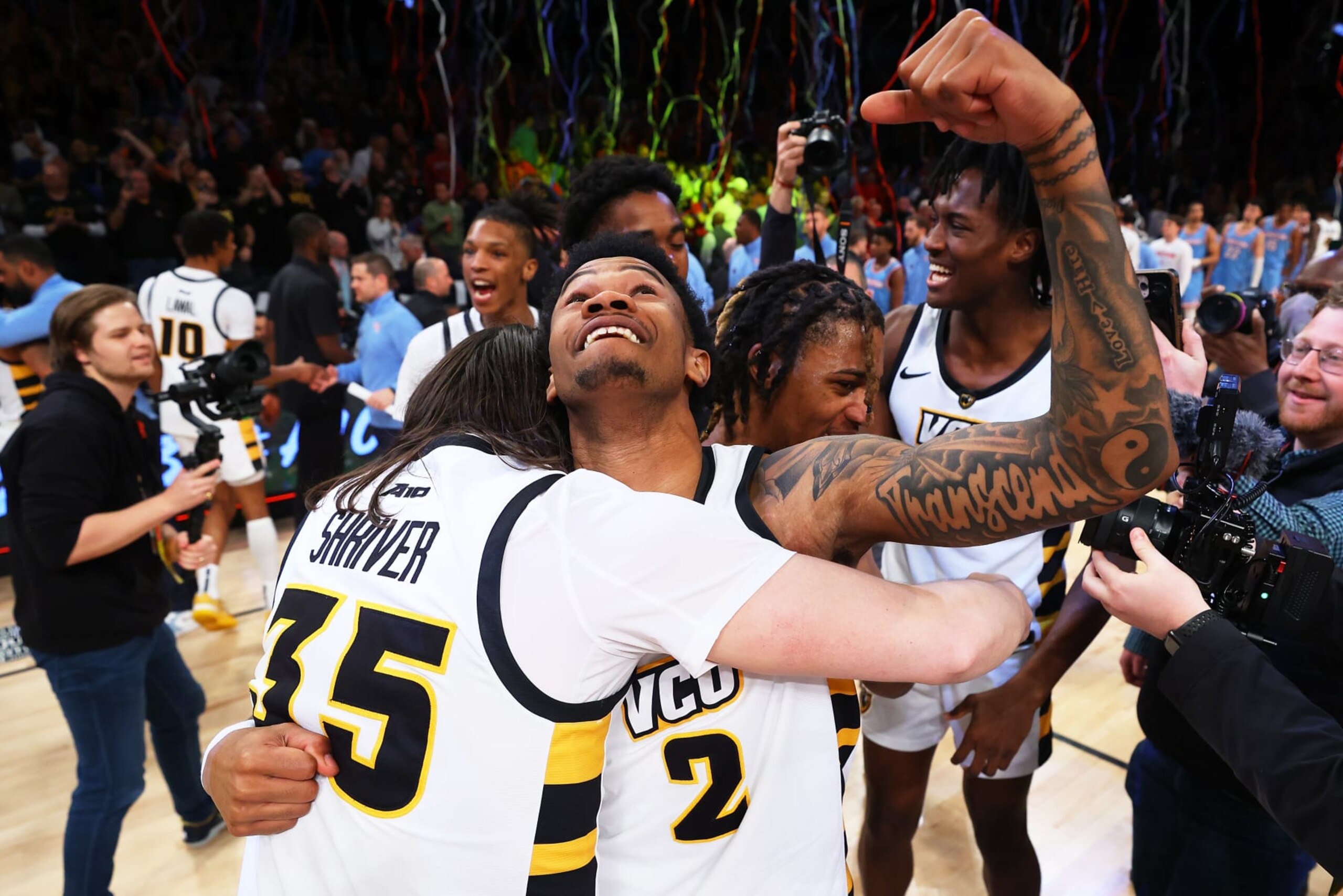 NEW YORK, NEW YORK - MARCH 12: Zeb Jackson #2 and David Shriver #35 of the Virginia Commonwealth Rams celebrates after defeating Dayton Flyers to win the A10 Basketball Tournament Championship at Barclays Center on March 12, 2023 in New York City. Virginia Commonwealth Rams defeated Dayton Flyers 68-56. (Photo by Mike Stobe/Getty Images)