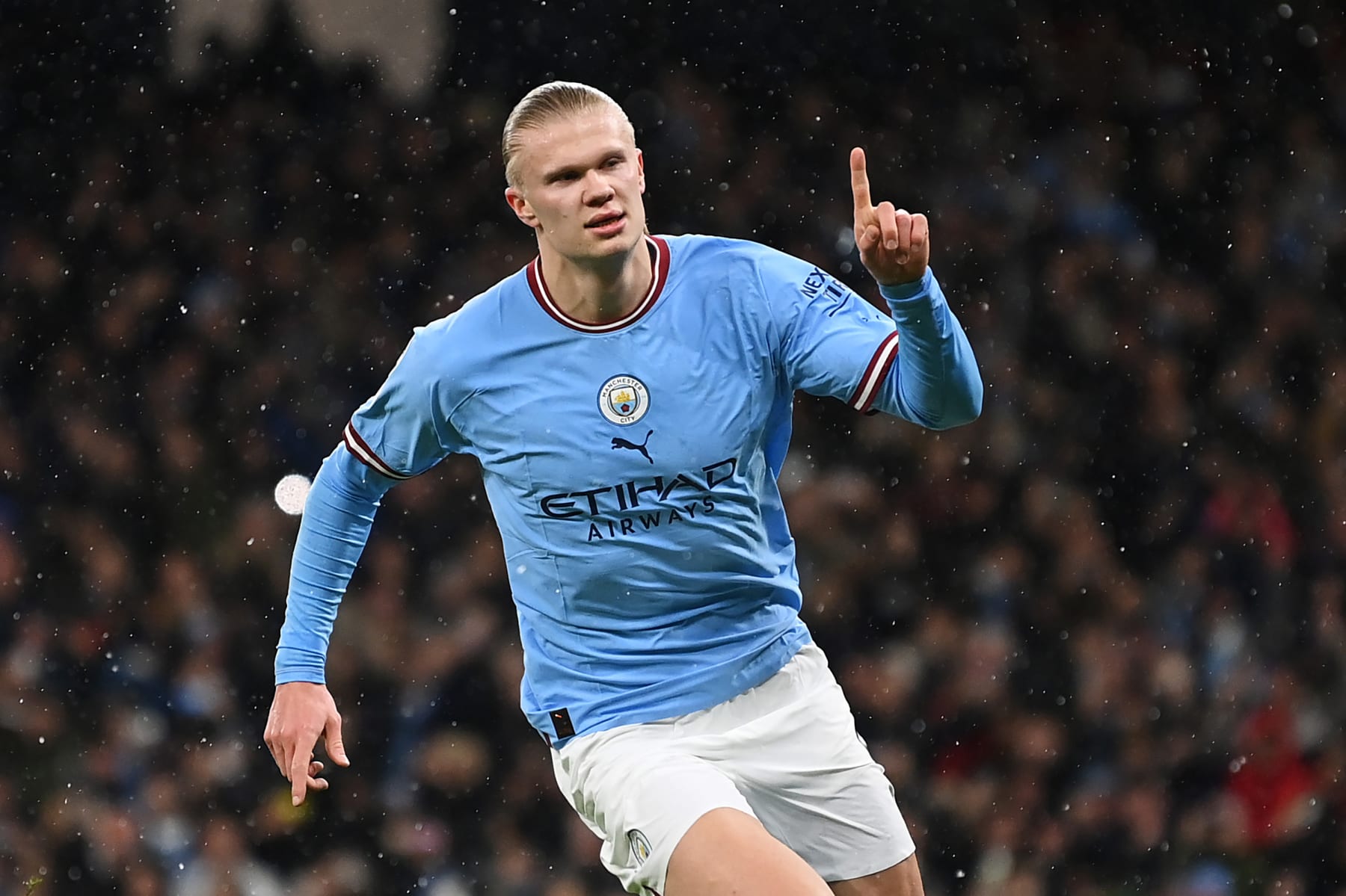 MANCHESTER, ENGLAND - MARCH 14: Erling Haaland of Manchester City celebrates after scoring the team's first goal from a penalty kick during the UEFA Champions League round of 16 leg two match between Manchester City and RB Leipzig at Etihad Stadium on March 14, 2023 in Manchester, England. (Photo by Michael Regan - UEFA/UEFA via Getty Images)