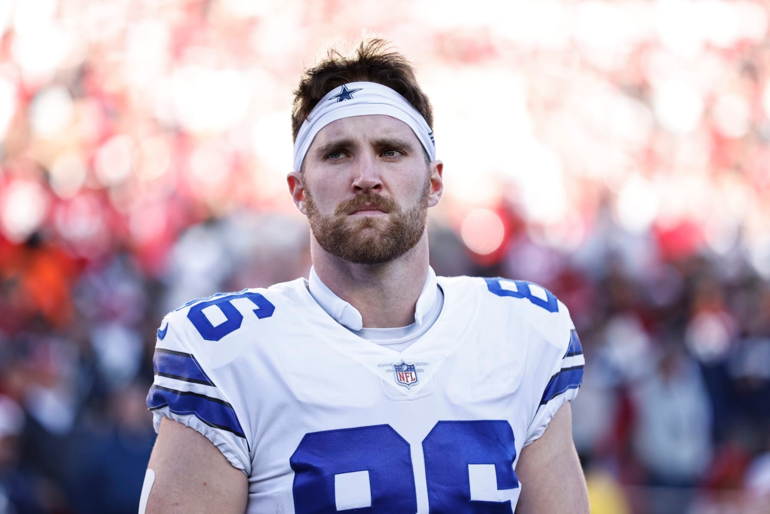 SANTA CLARA, CALIFORNIA - JANUARY 22: Dalton Schultz #86 of the Dallas Cowboys looks on during the national anthem prior to an NFL divisional round playoff football game between the San Francisco 49ers and the Dallas Cowboys at Levi's Stadium on January 22, 2023 in Santa Clara, California. (Photo by Michael Owens/Getty Images)